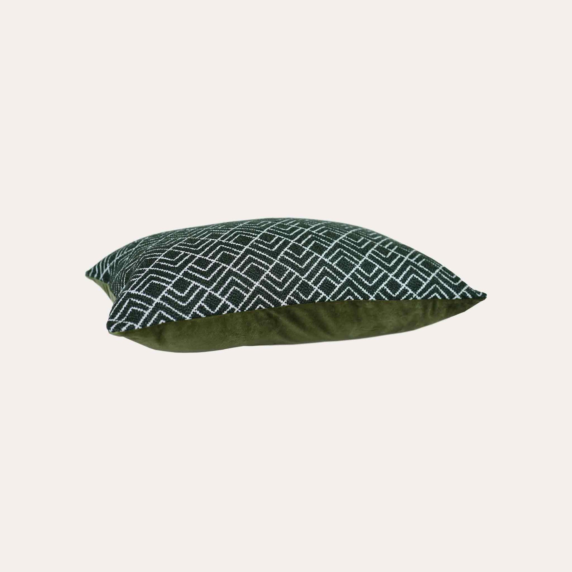 A stylish green and white geometric pattern cushion cover ideal for modern home decor.