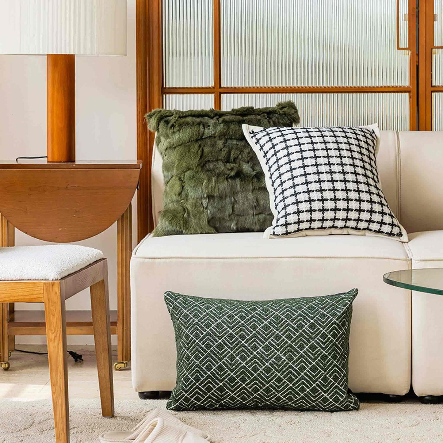 A stylish green and white geometric pattern cushion cover ideal for modern home decor.