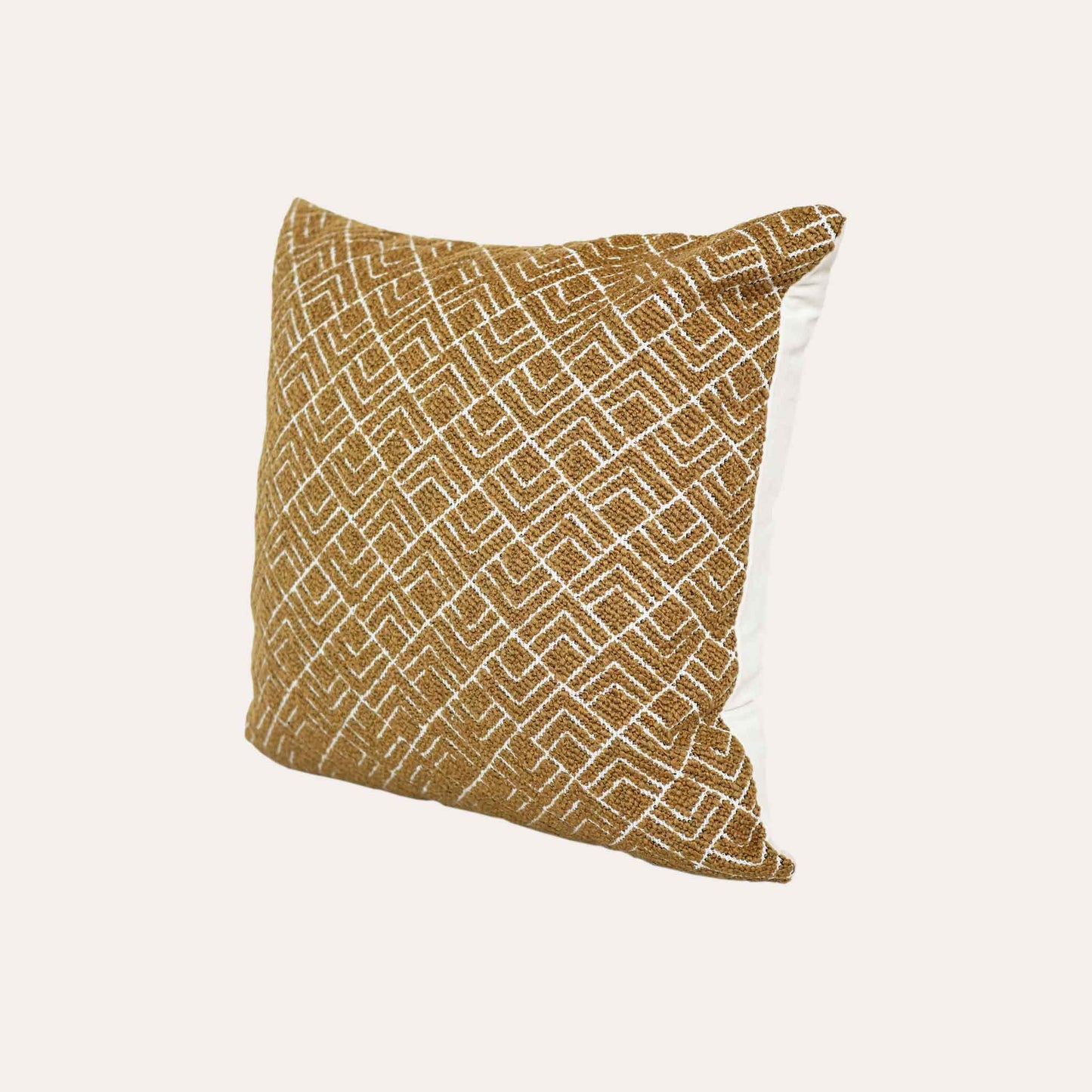 A vibrant yellow cushion cover with a modern geometric pattern, crafted from durable cut pile jacquard.