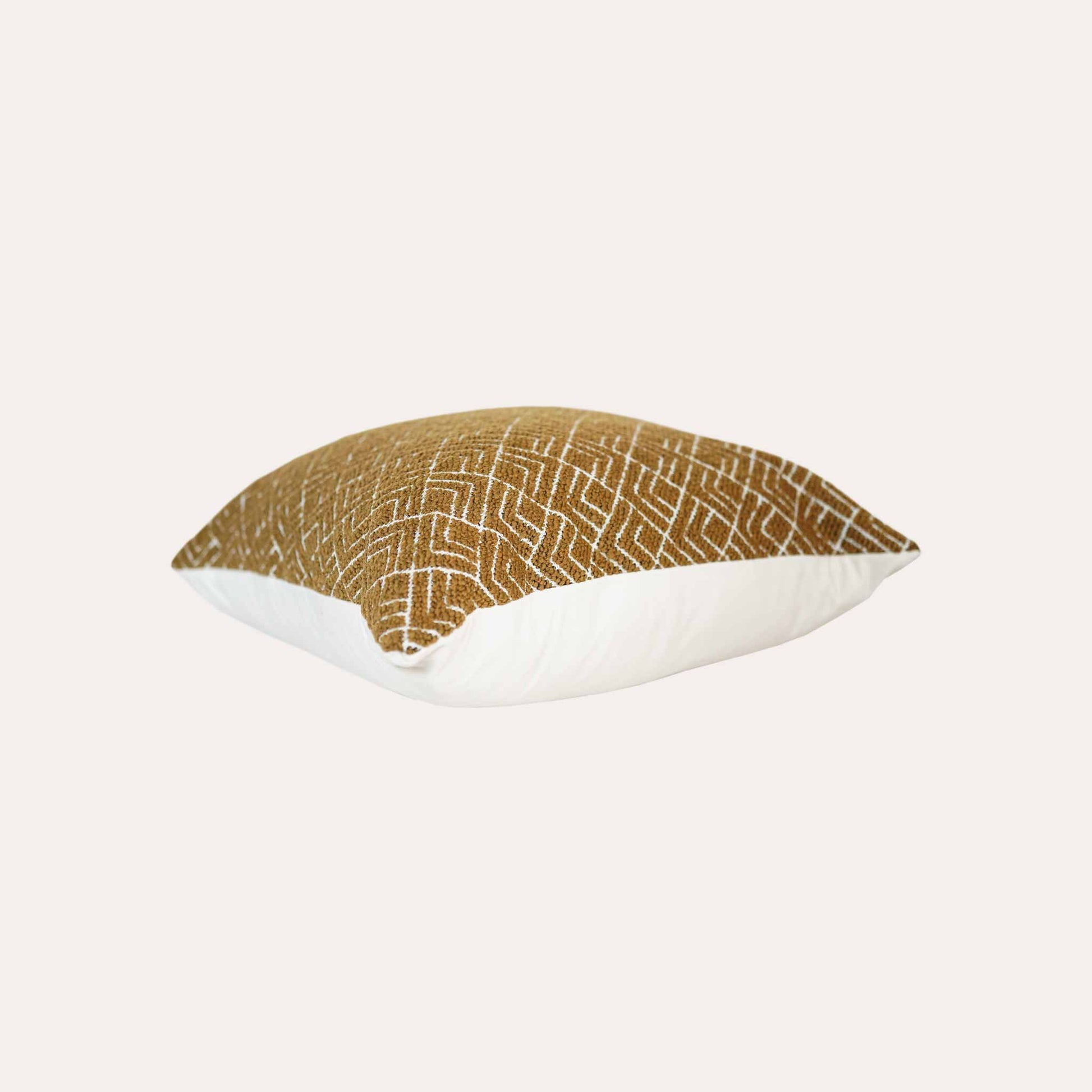 A vibrant yellow cushion cover with a modern geometric pattern, crafted from durable cut pile jacquard.