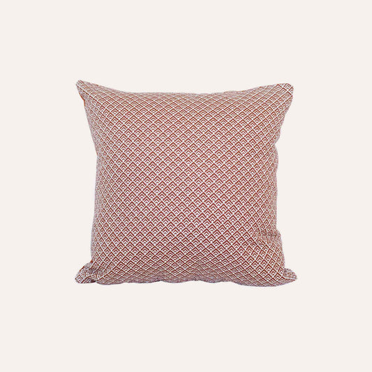 Geometric design cushion covers in red and white chenille fabric.