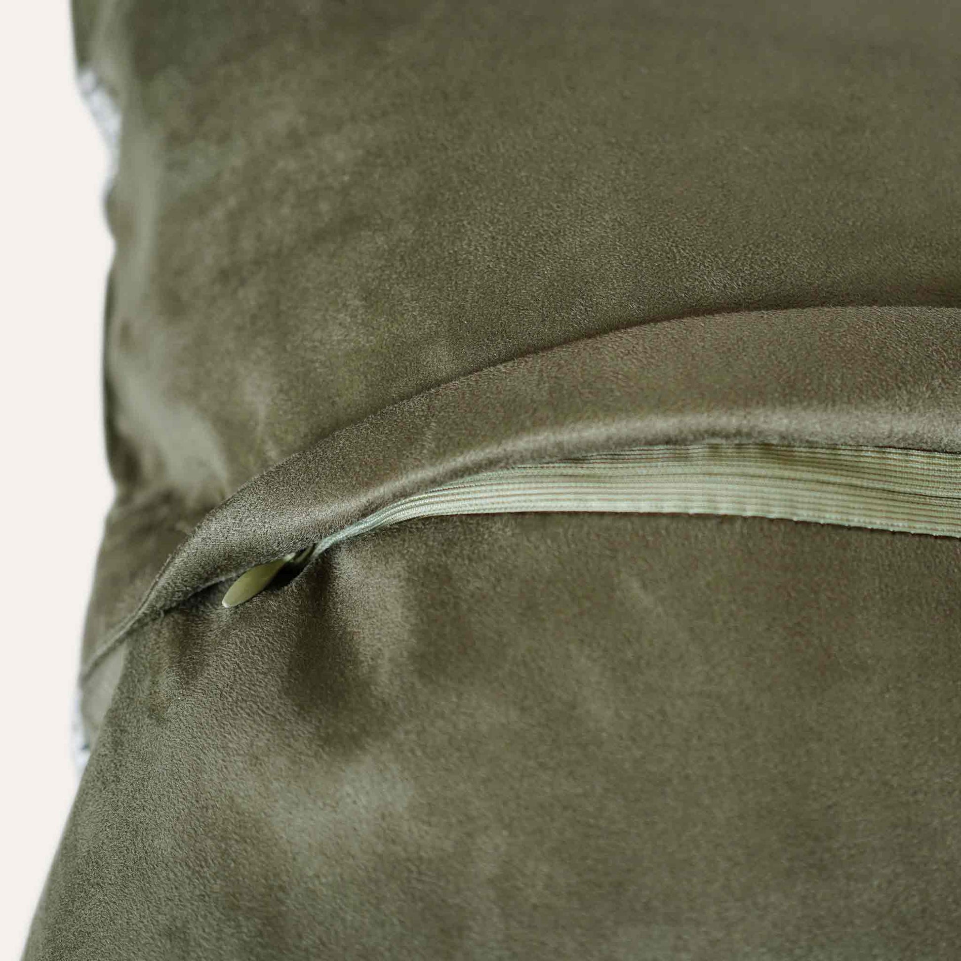 A green and grey irregular splicing design decorative cushion cover with invisible zipper.