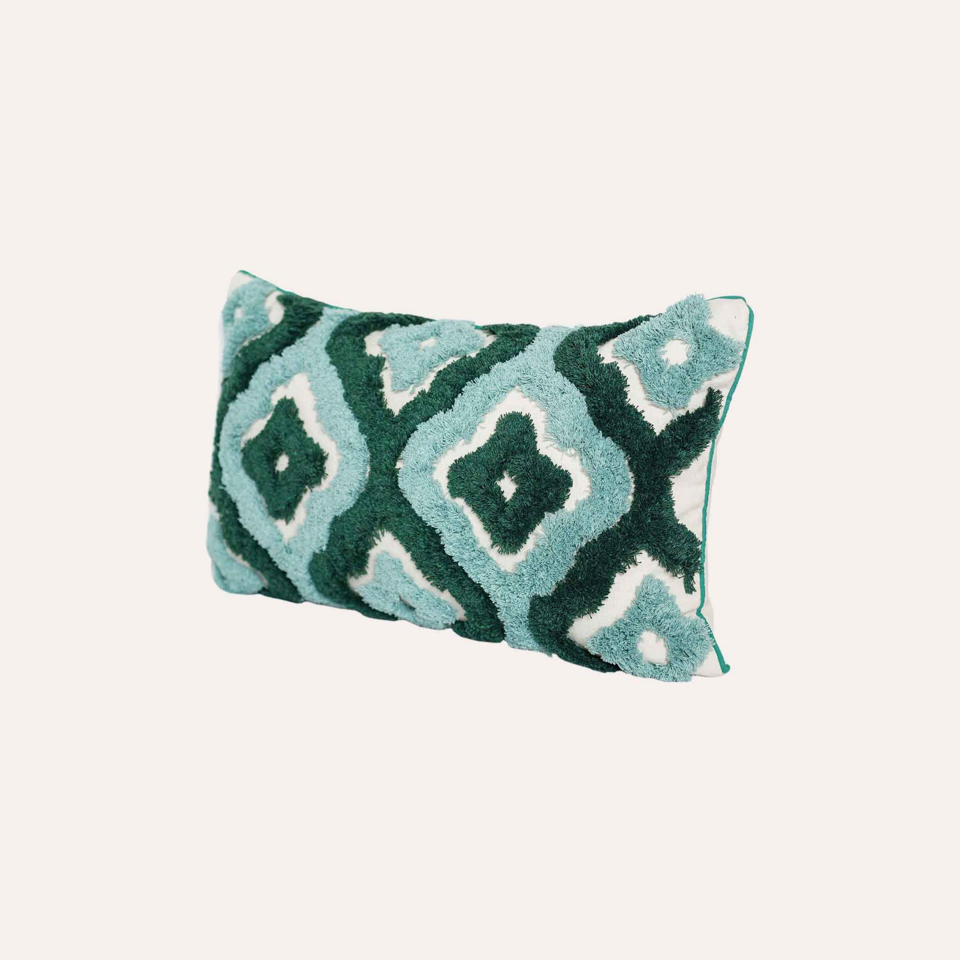 Two-tone turquoise tufted decorative lumbar cushion cover.