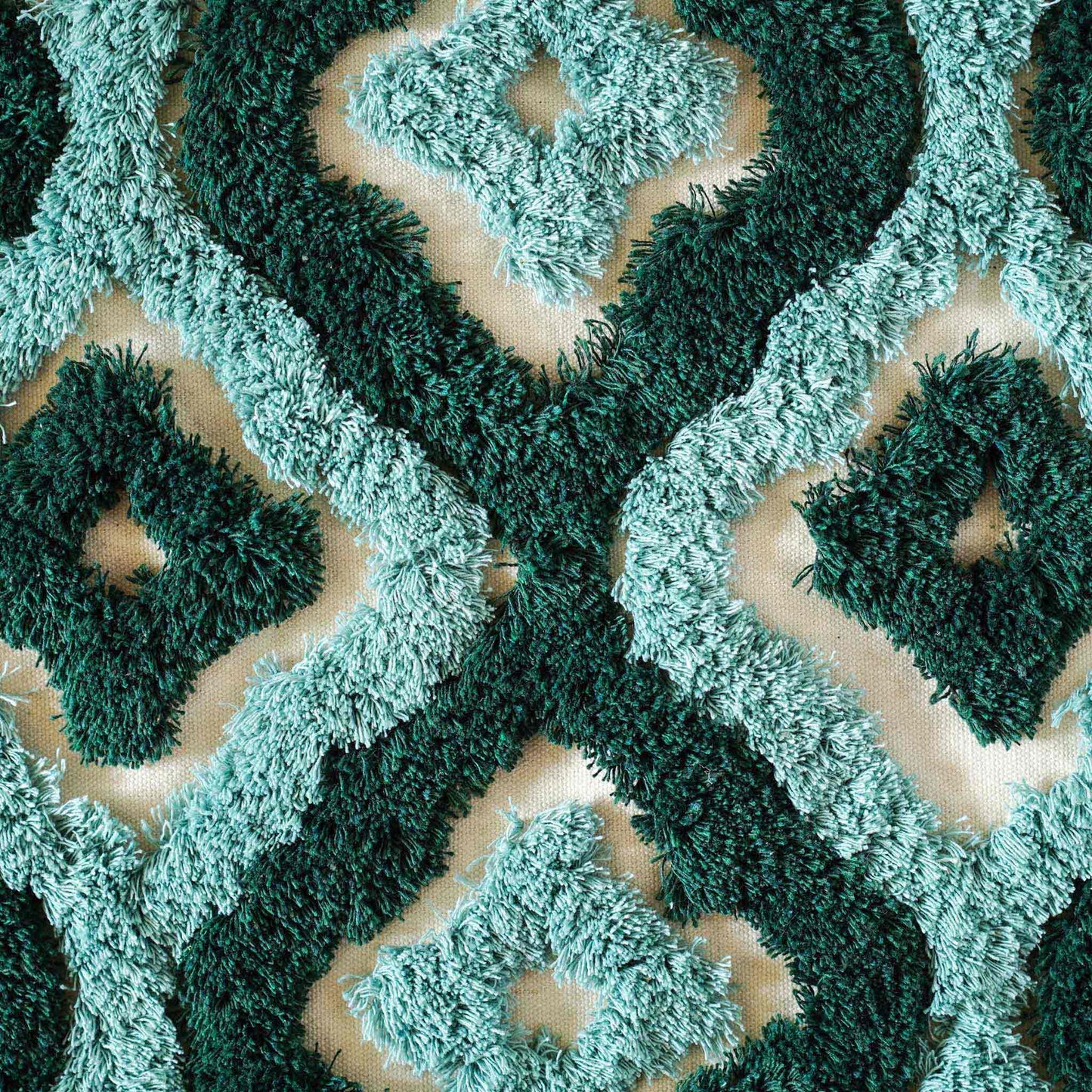 Two-tone turquoise tufted decorative lumbar cushion cover.