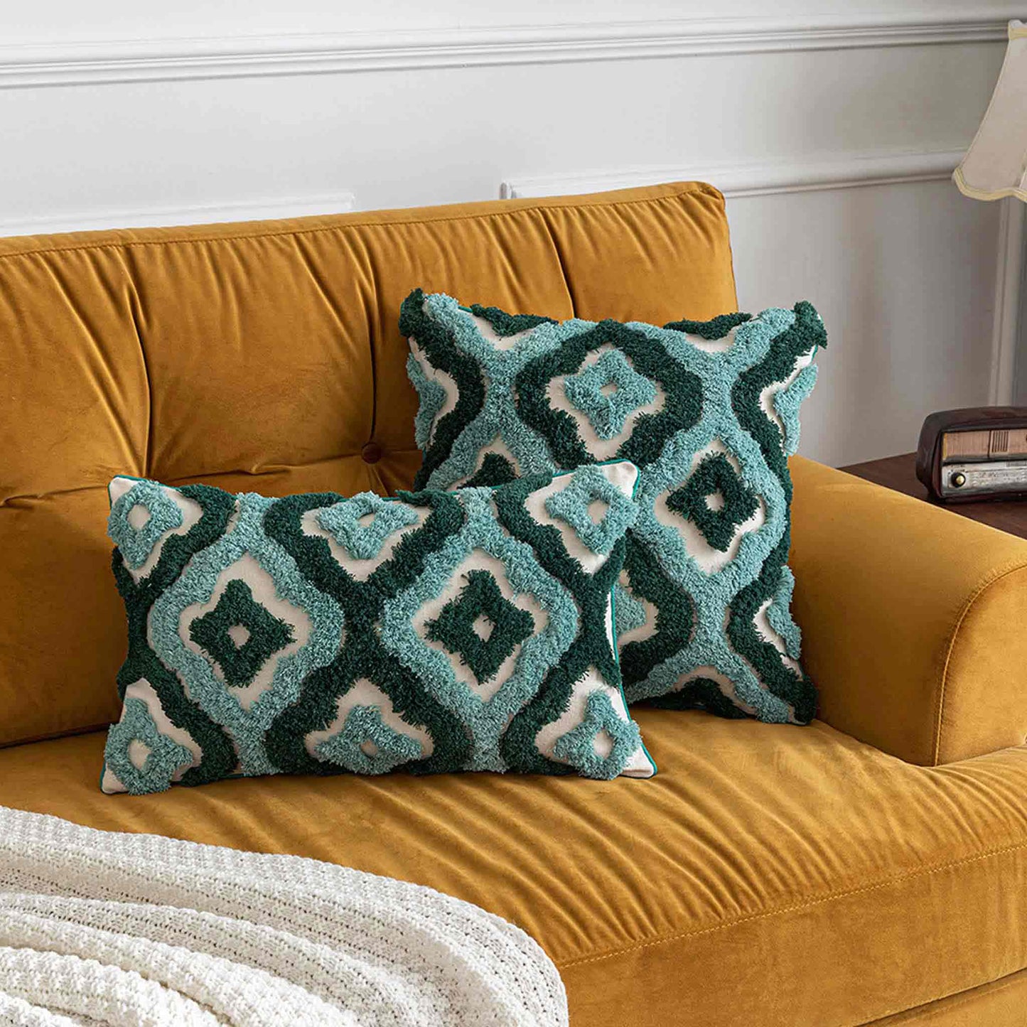 Two-tone turquoise tufted decorative lumbar cushion cover.