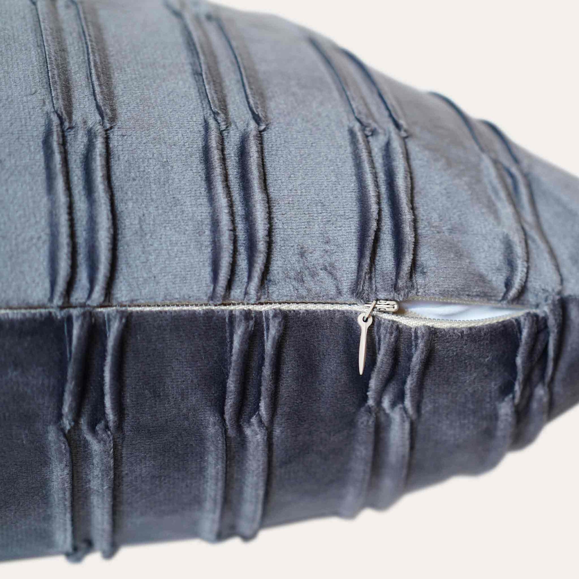 Dark grey pleated velvet lumbar cushion cover with invisible zipper.