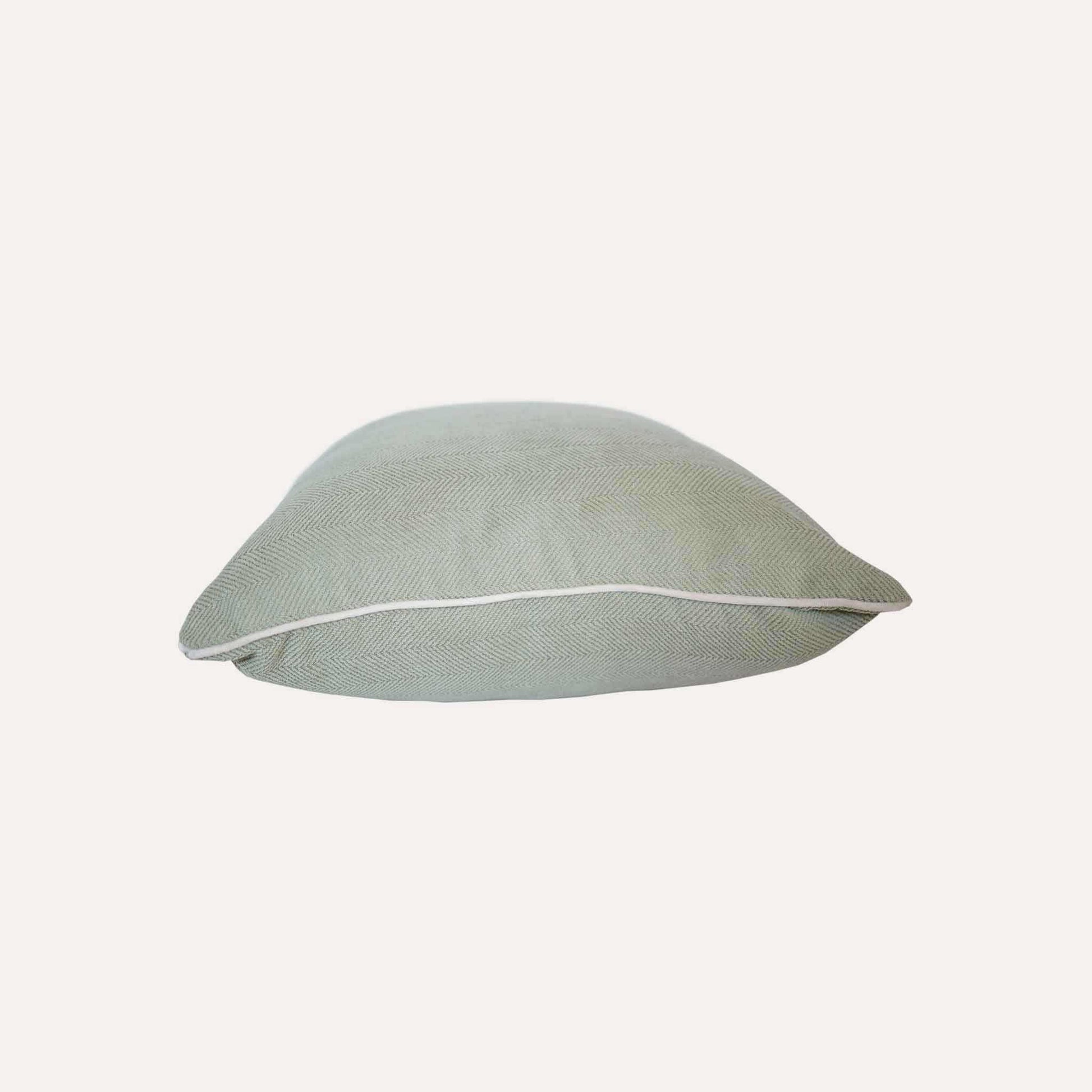 Mint green herringbone, white wrapped chenille cushion cover.