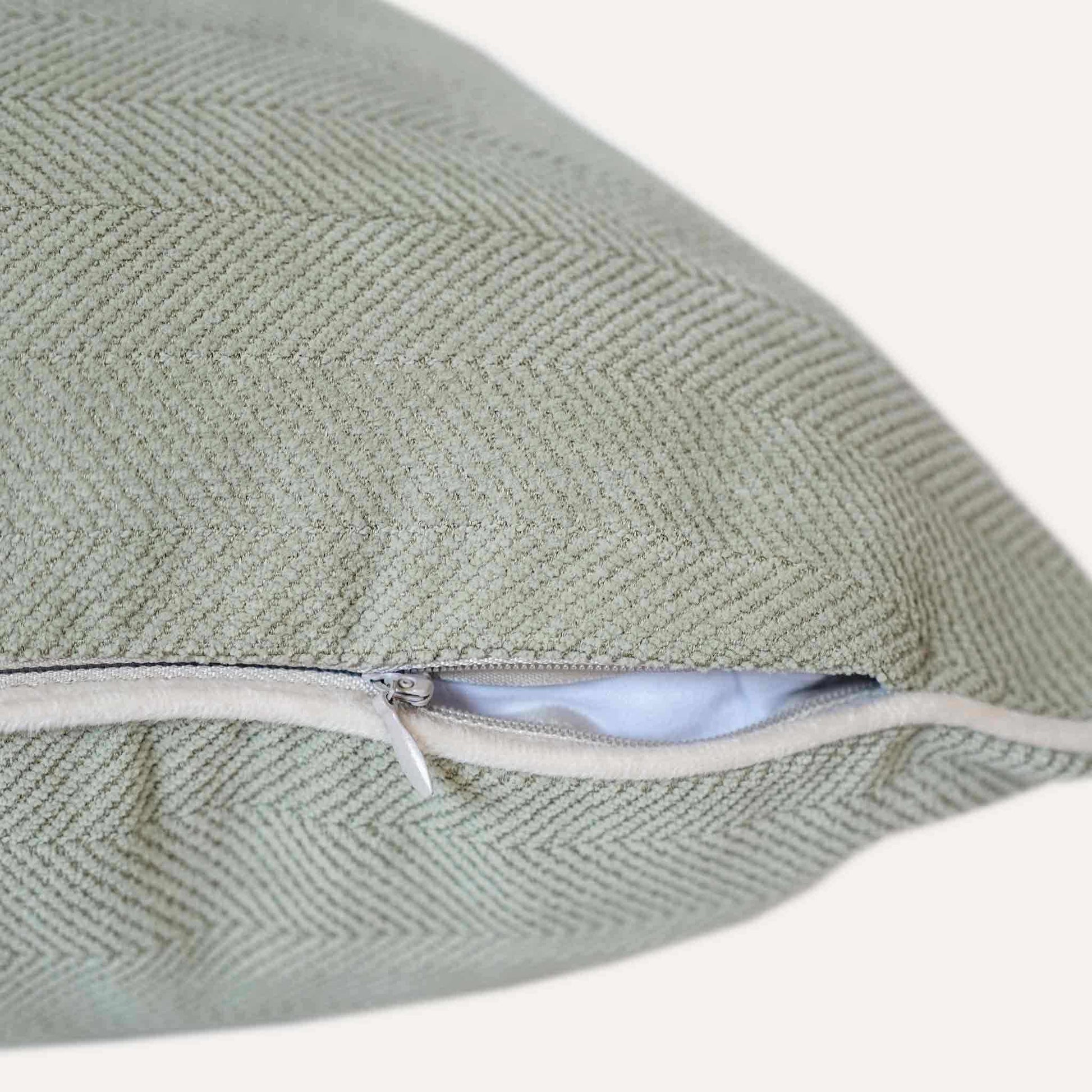 Mint green herringbone, white wrapped chenille cushion cover with invisible zipper.