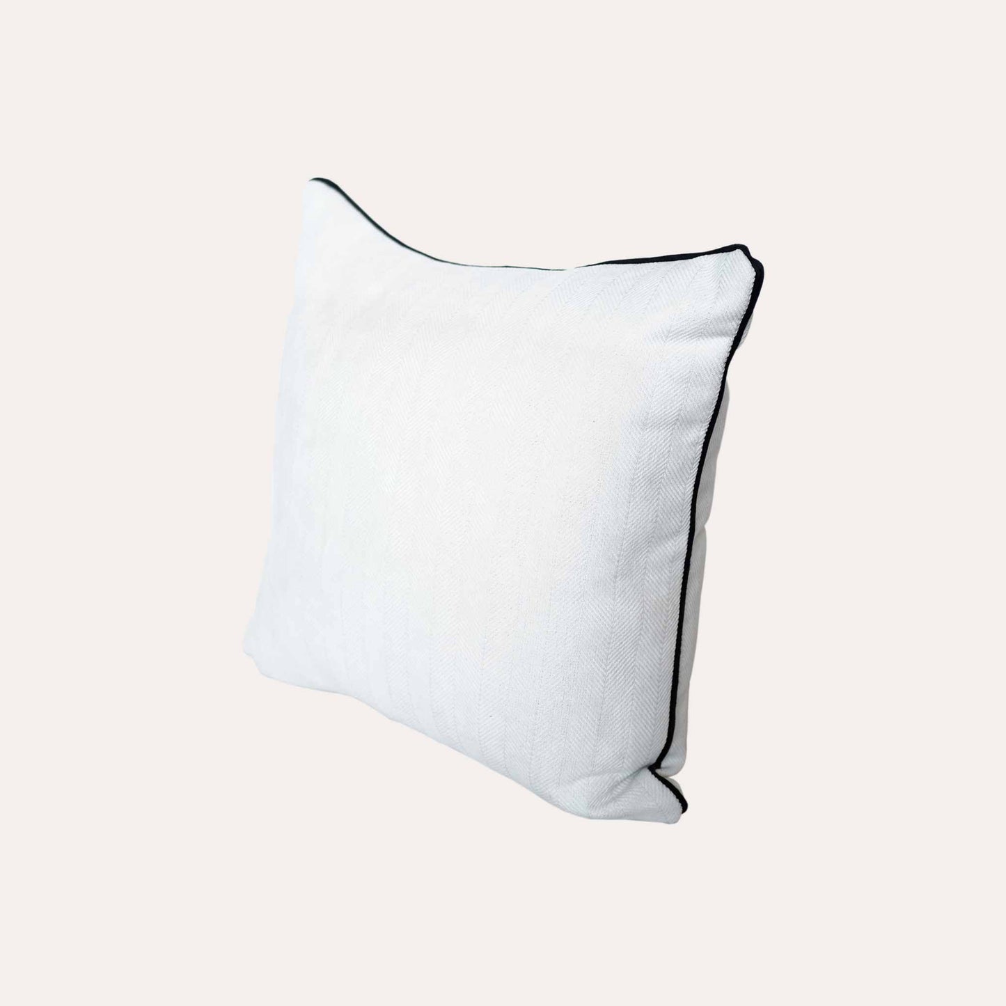A stylish white cushion cover with black piping, designed with a herringbone texture.