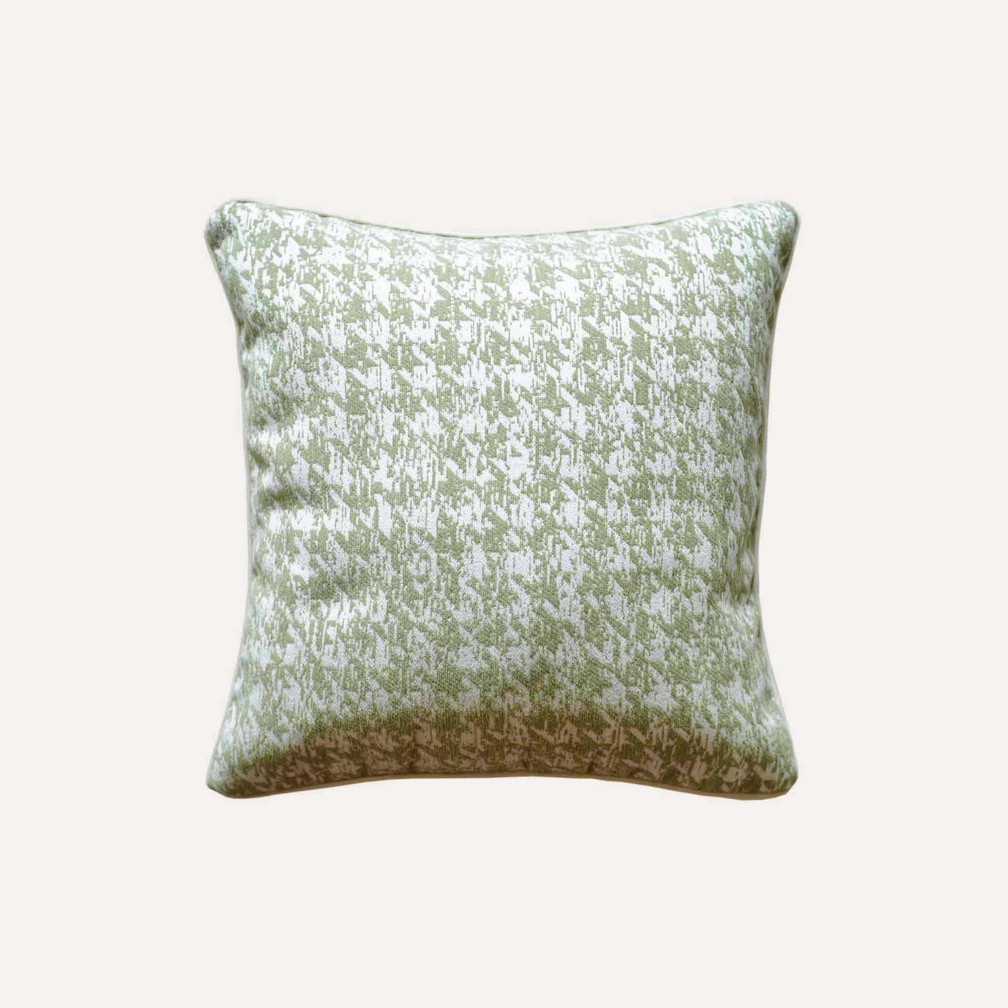 Decorative cushion cover featuring a green and white houndstooth pattern, crafted from soft chenille fabric.