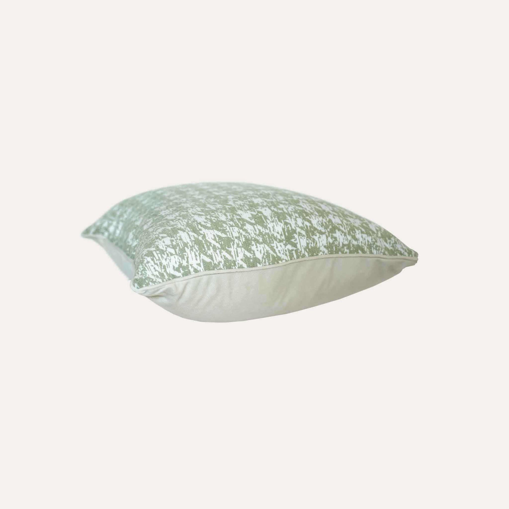 Decorative cushion cover featuring a green and white houndstooth pattern, crafted from soft chenille fabric.