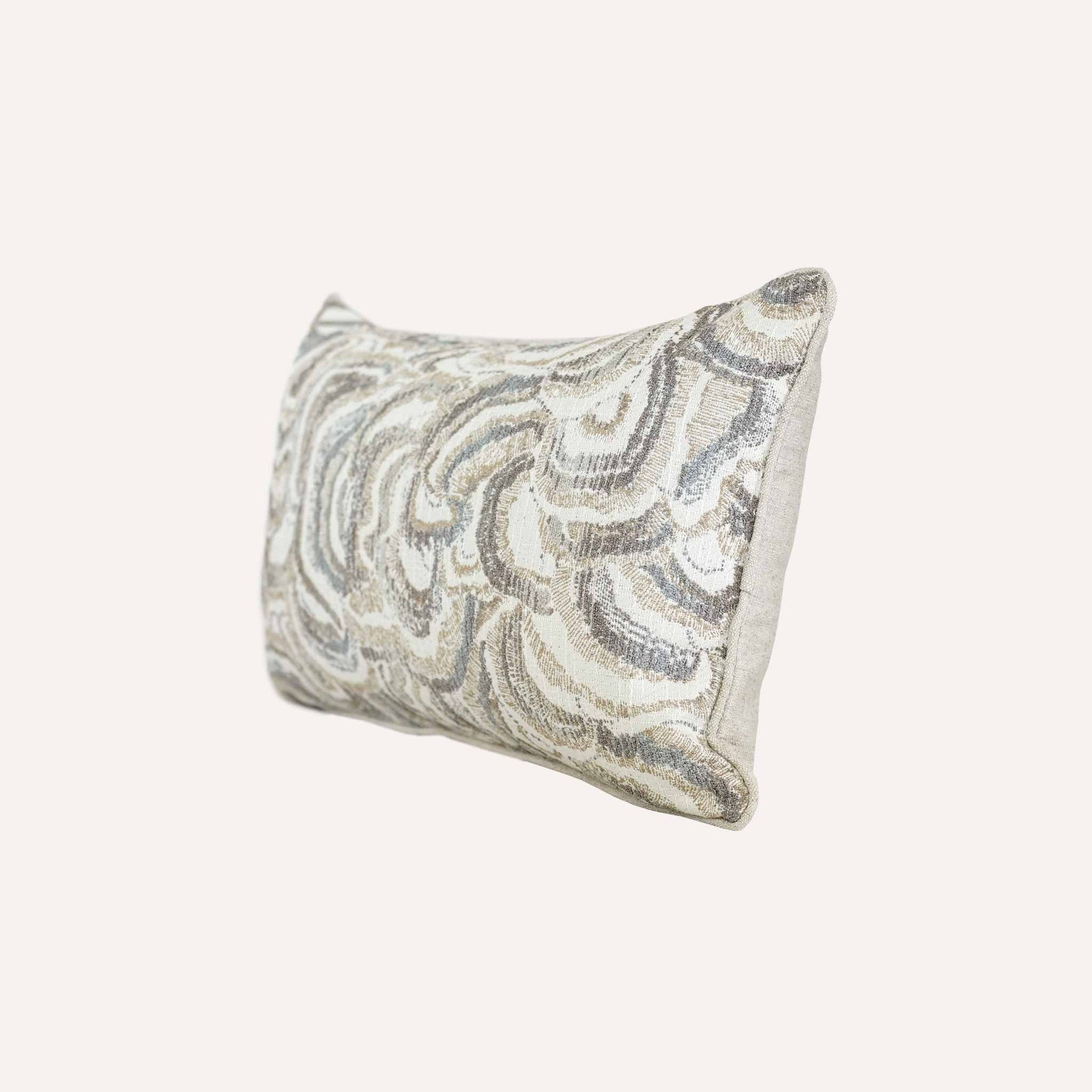 This white and grey mother-of-pearl patterned decorative lumbar cushion adds a contemporary touch to home décor.