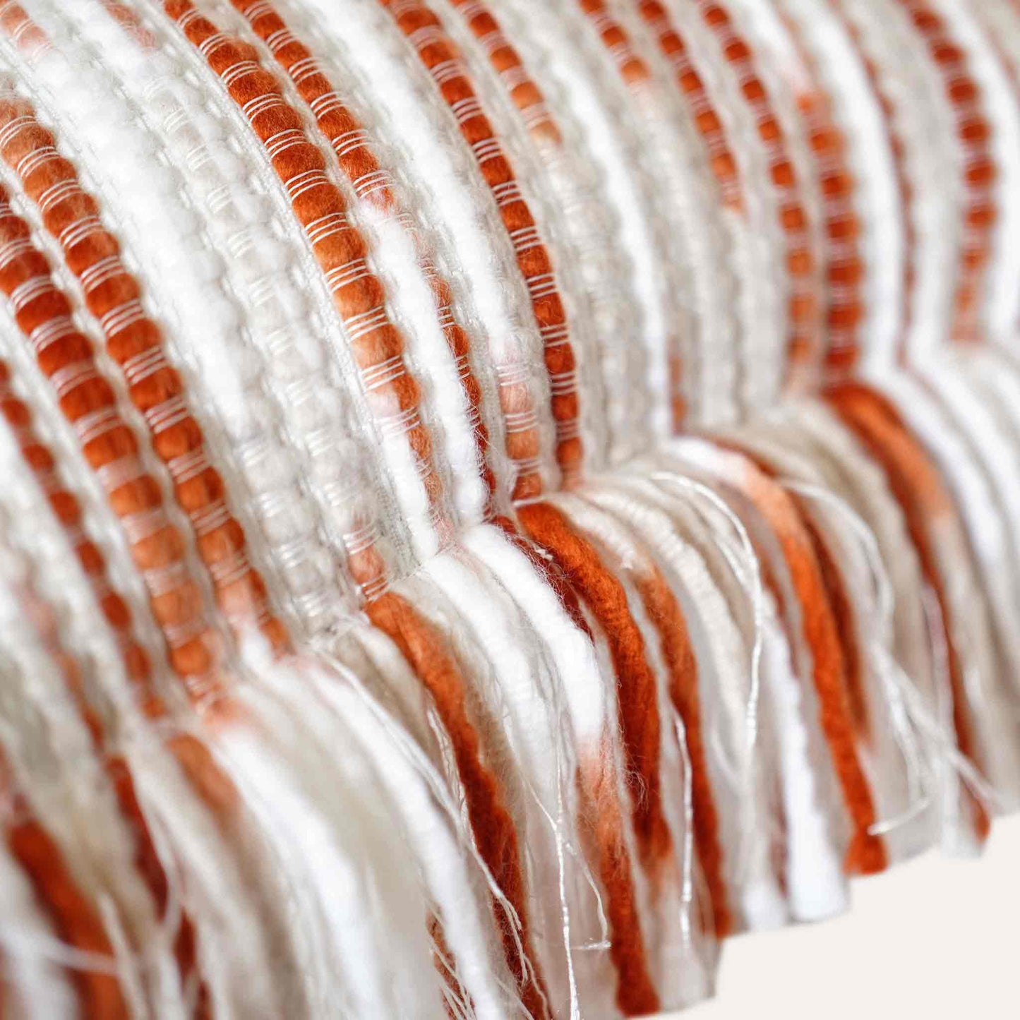 Ivory red mixed color woven fringe cushion cover.
