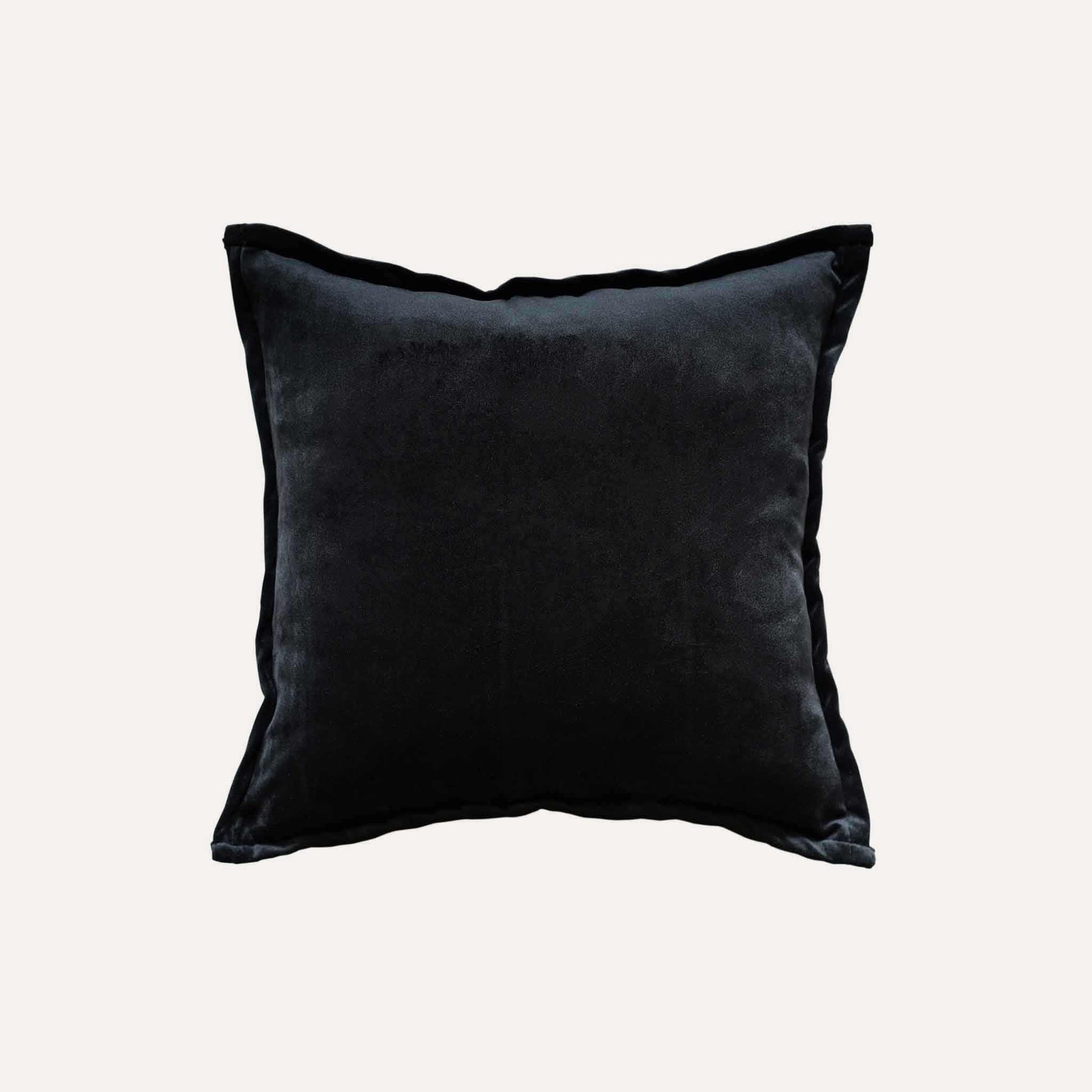 Black and white abstract shadow pattern cushion cover with black back.