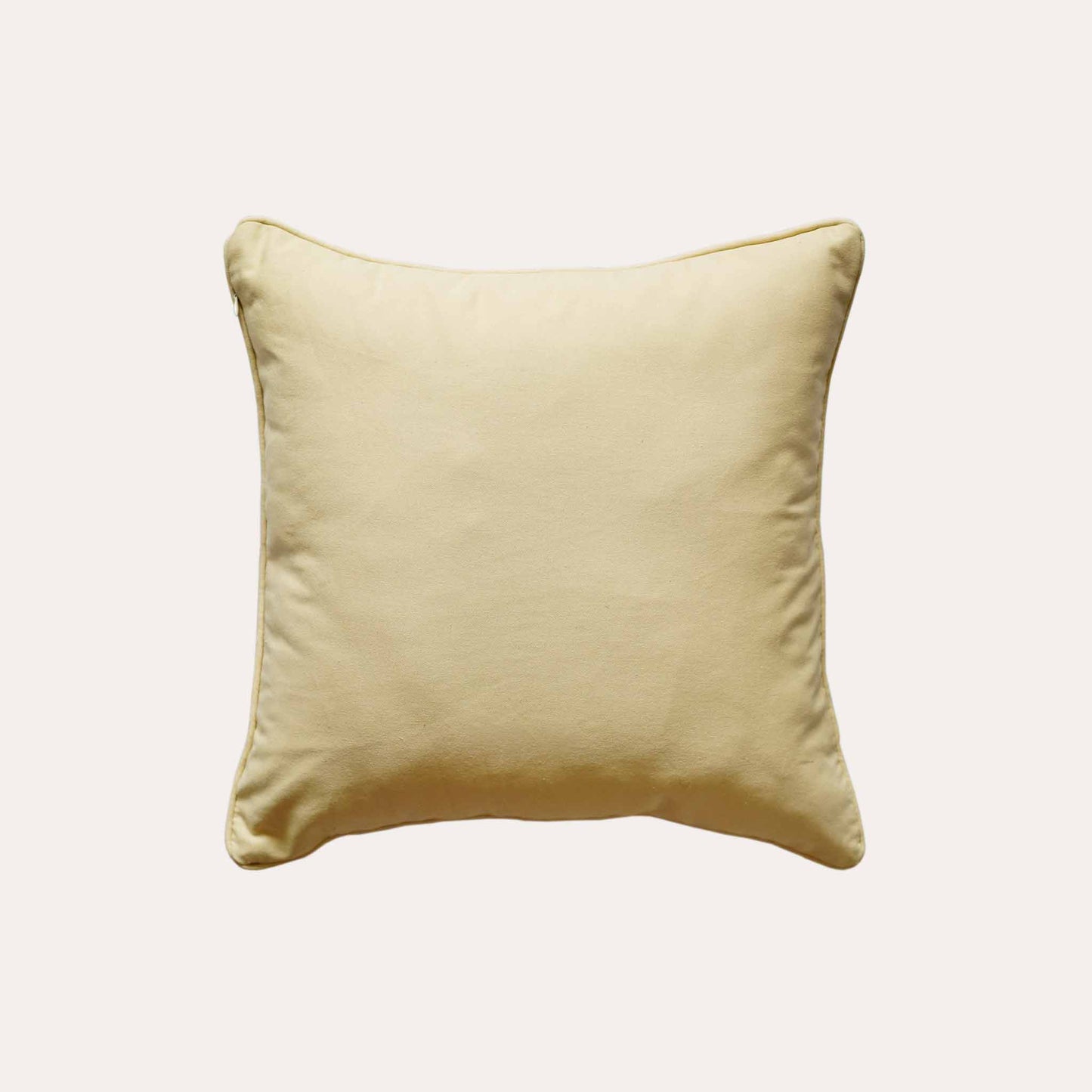 Charming yellow and beige botanical cushion covers with solid yellow back.