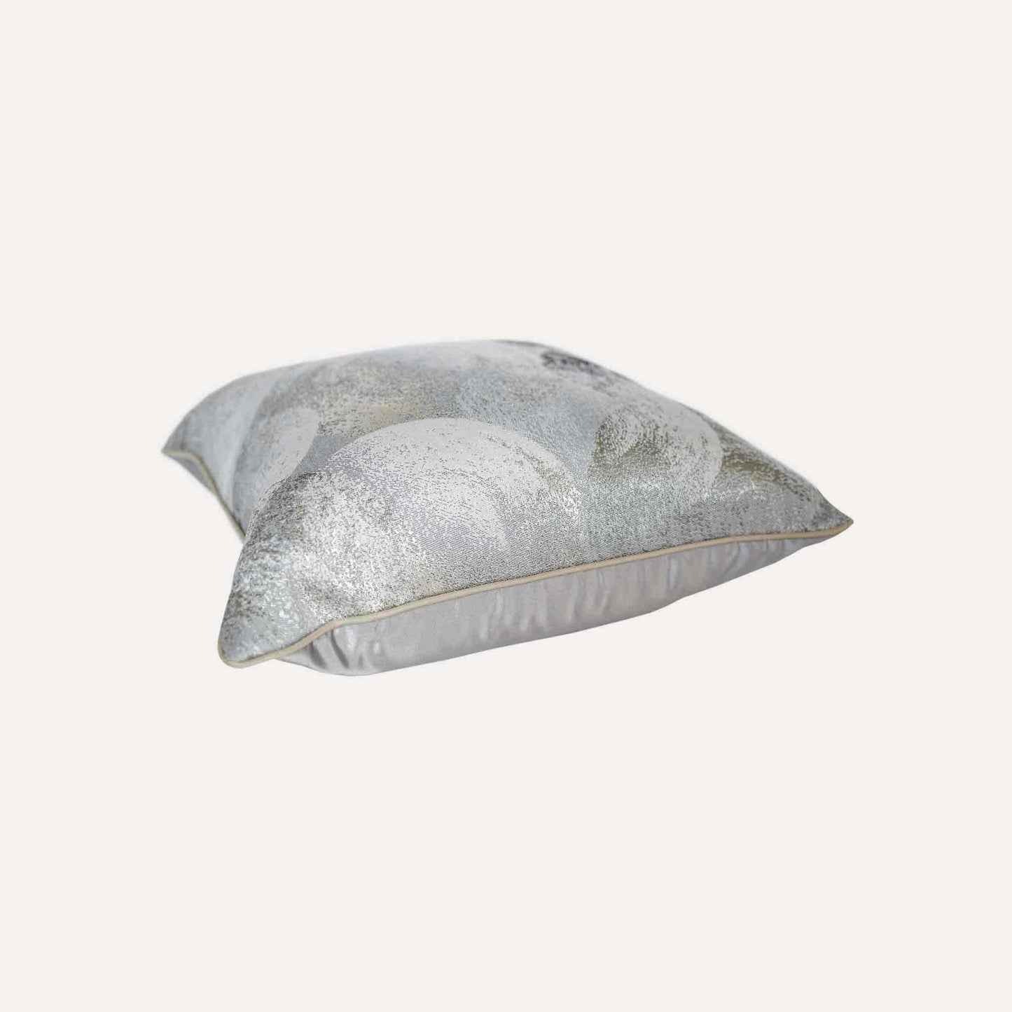 A luxurious silver and grey jacquard cushion cover featuring an abstract design.