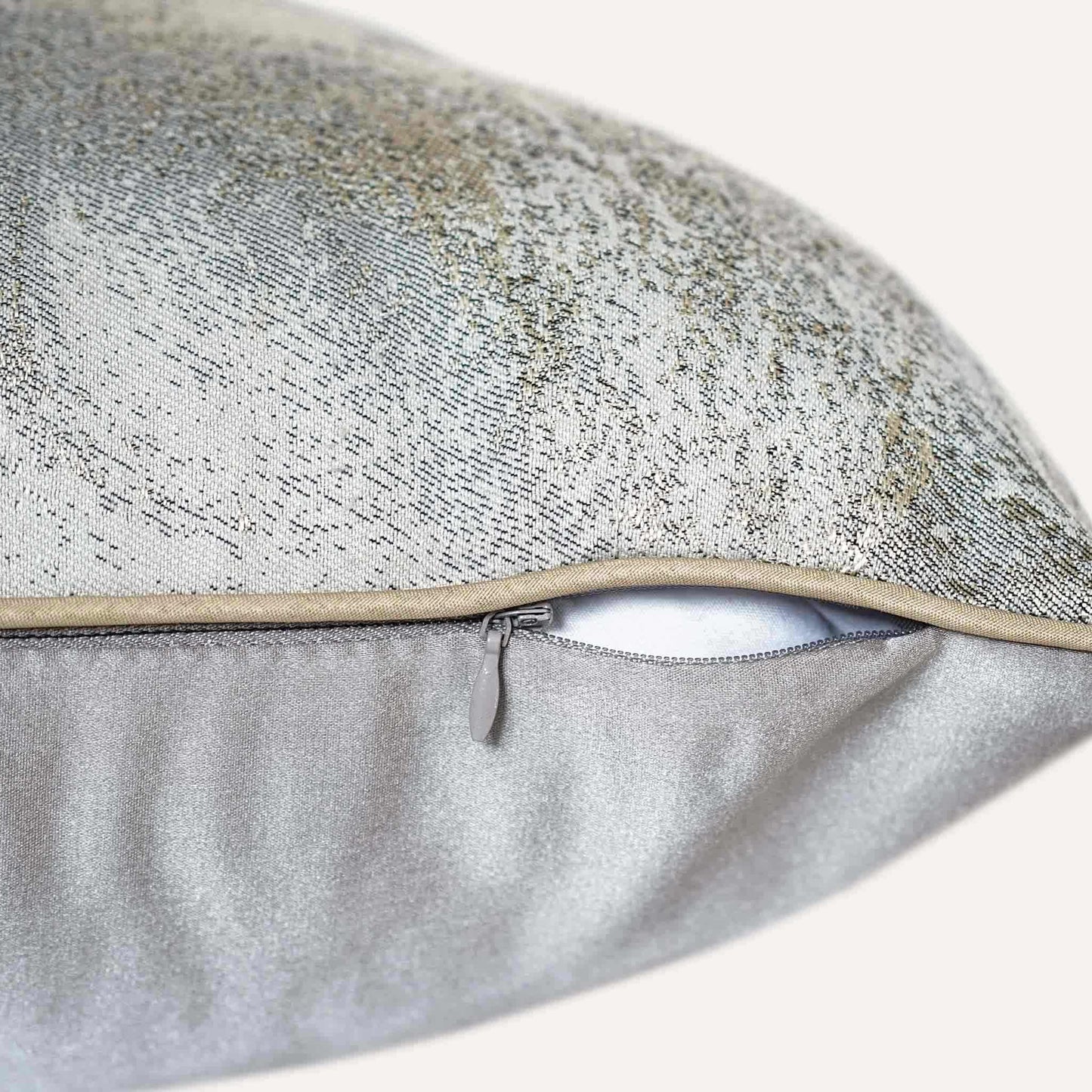 A luxurious silver and grey abstract jacquard cushion cover with invisible zipper.