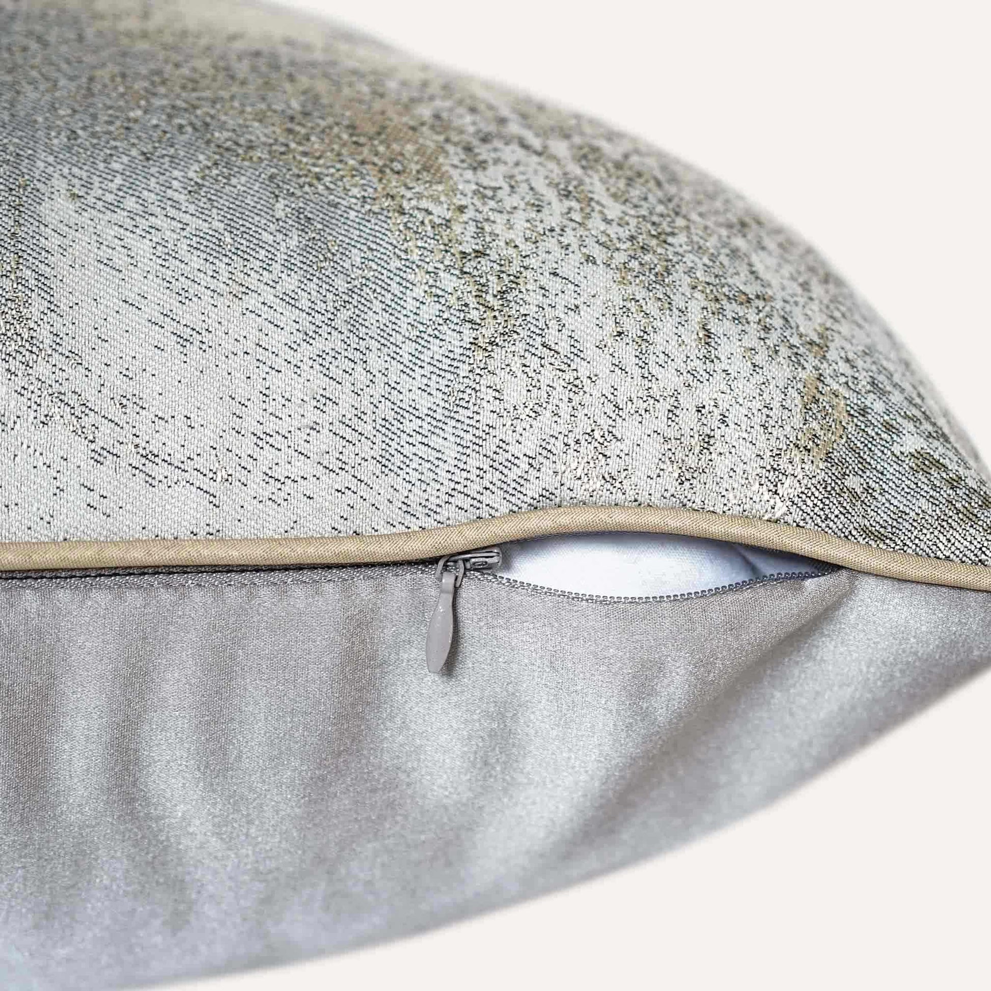 A luxurious silver and grey abstract jacquard cushion cover with invisible zipper.