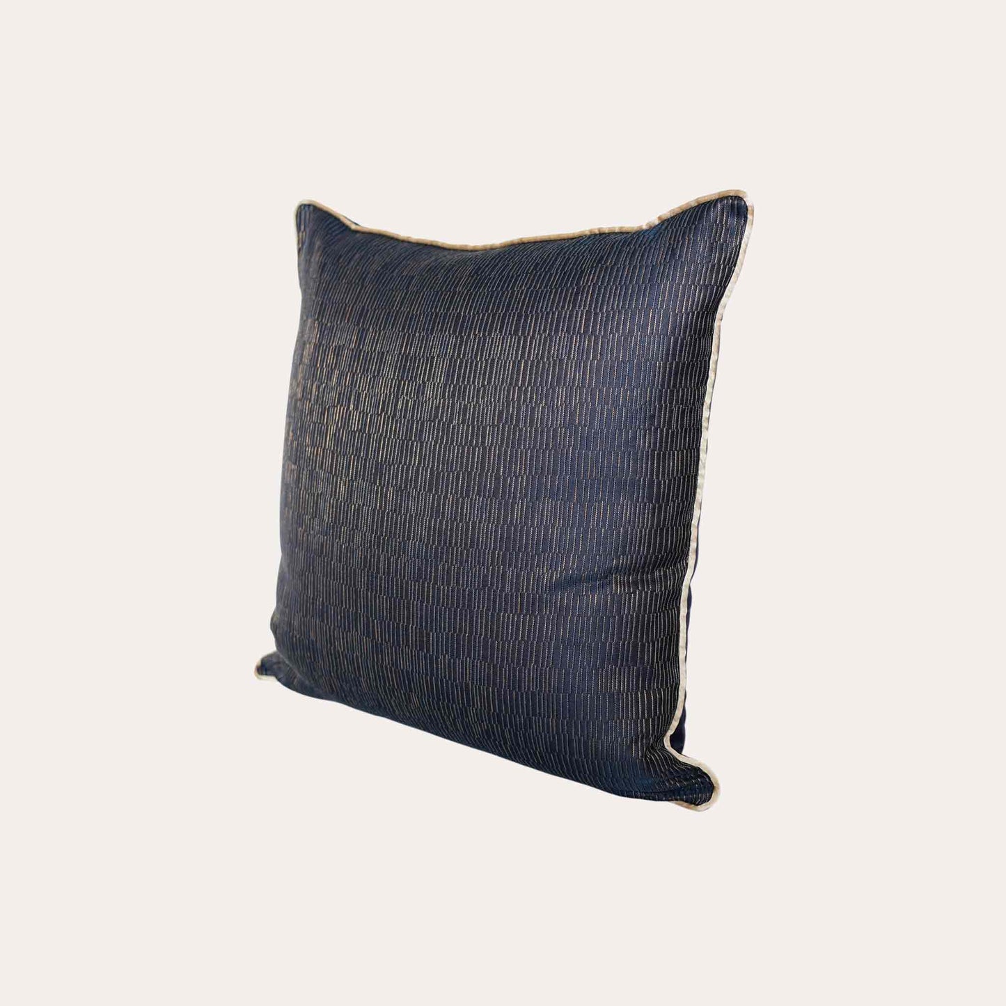 A cushion cover featuring a navy base adorned with delicate gold lines, exuding a sense of luxury.