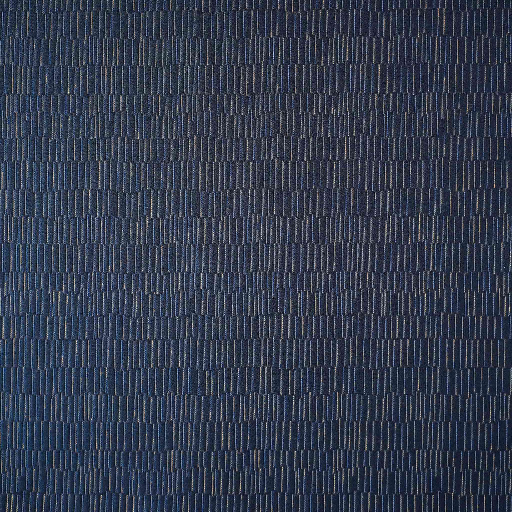 A cushion cover featuring a navy base adorned with delicate gold lines, exuding a sense of luxury.