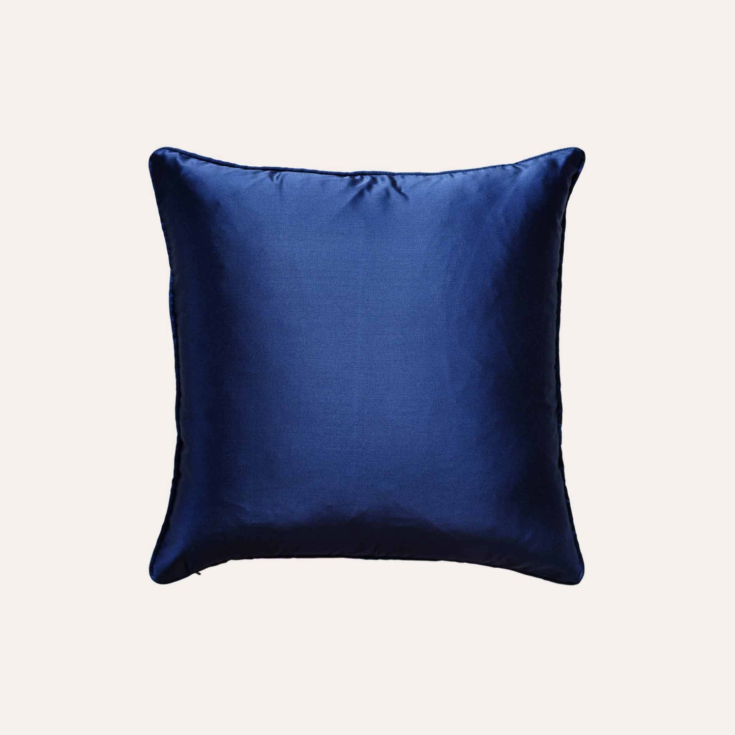 The navy blue cushion cover features subtle gold mesh designs with blue back.
