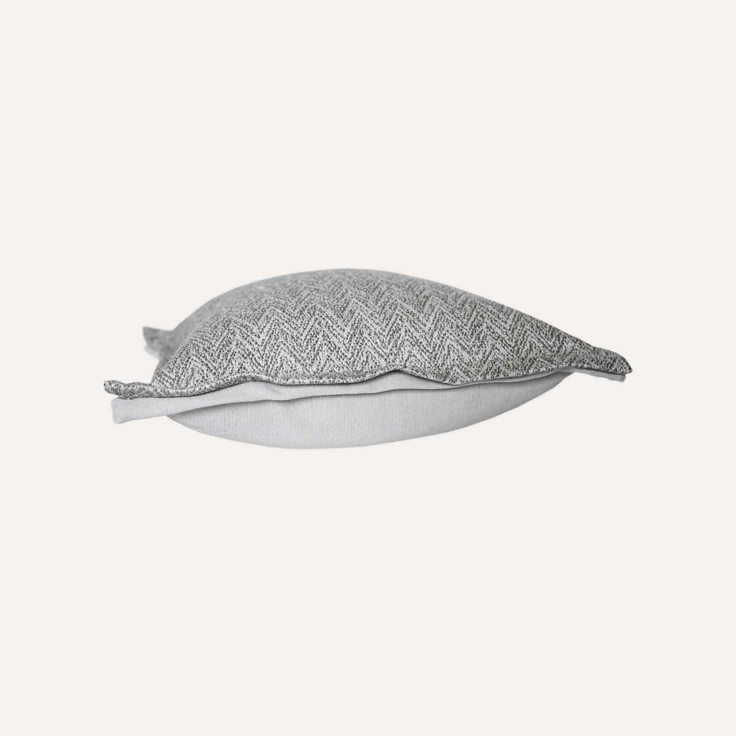 Elegant herringbone linen-cotton broadside cushion cover in a sophisticated off-white design.