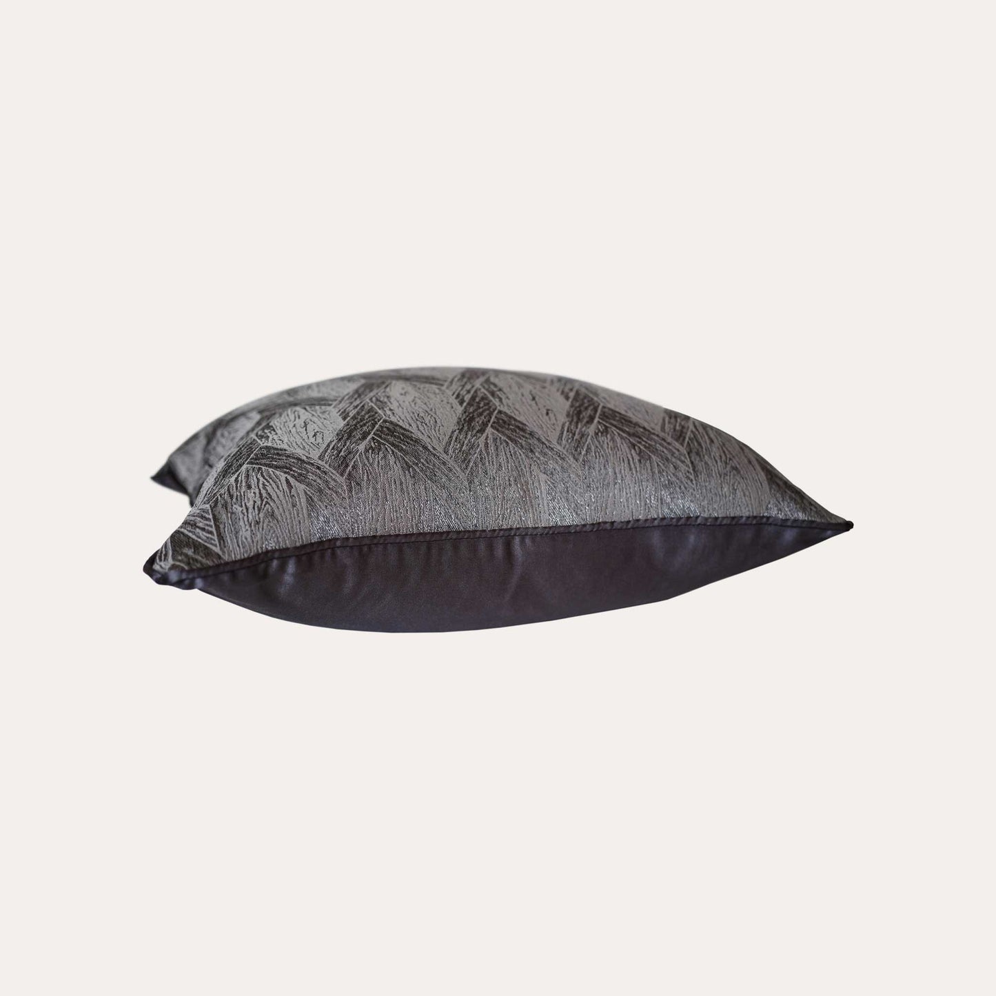 Elegant gray and black cushions featuring stylish geometric designs.