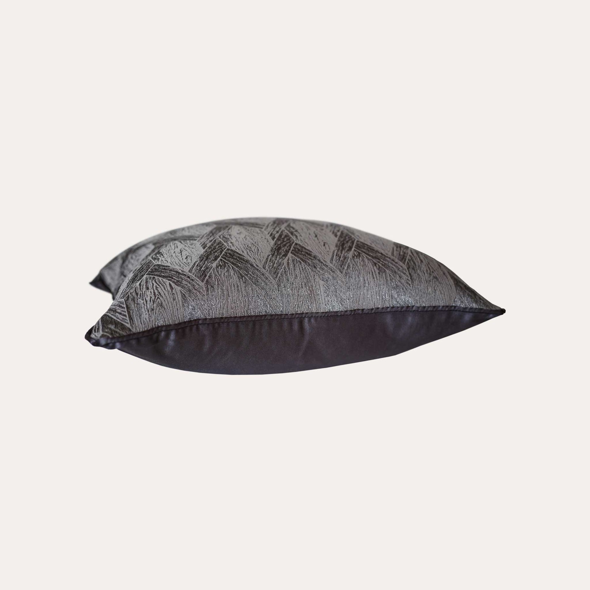 Elegant gray and black cushions featuring stylish geometric designs.