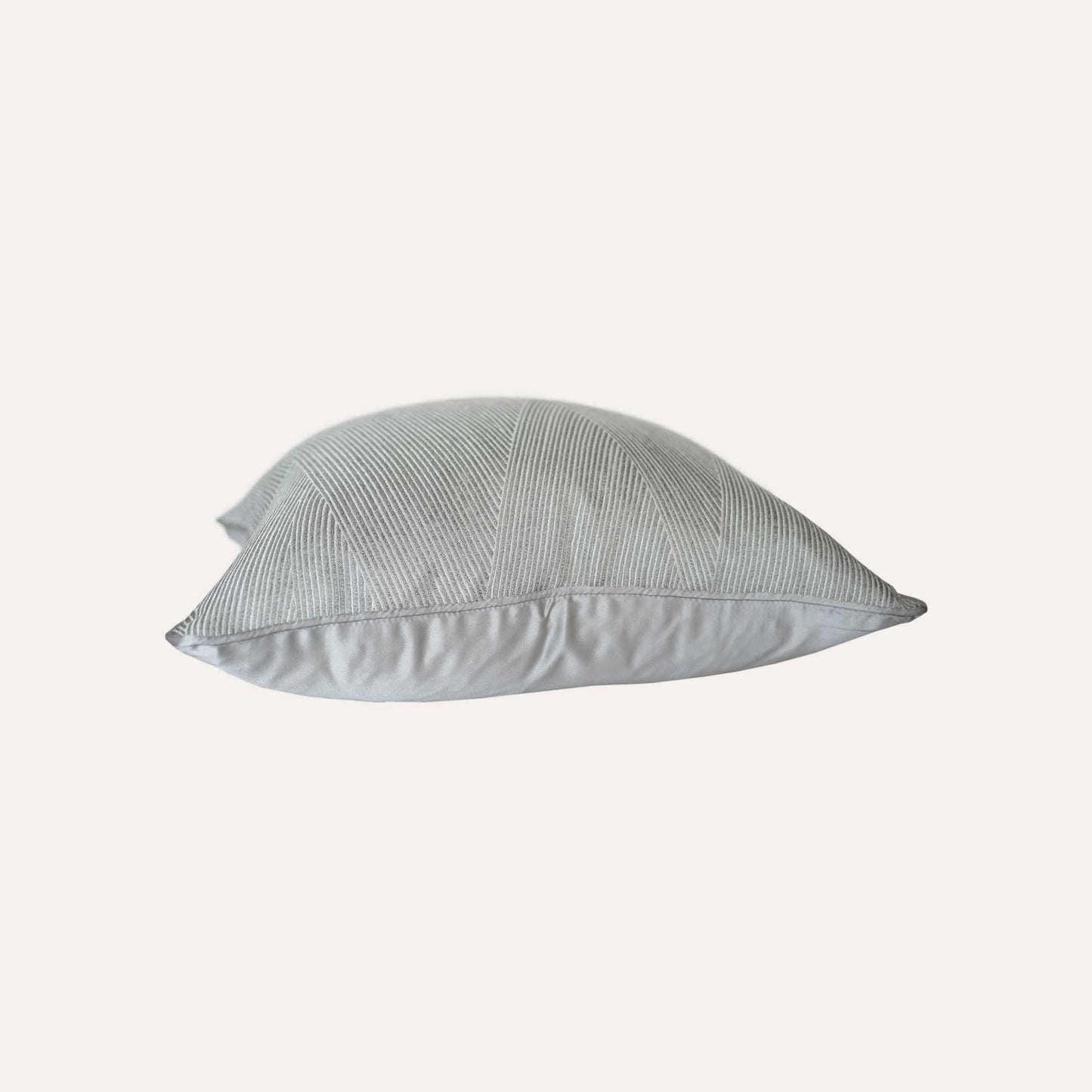 Luxurious silver gray cushion cover with chic striped design.
