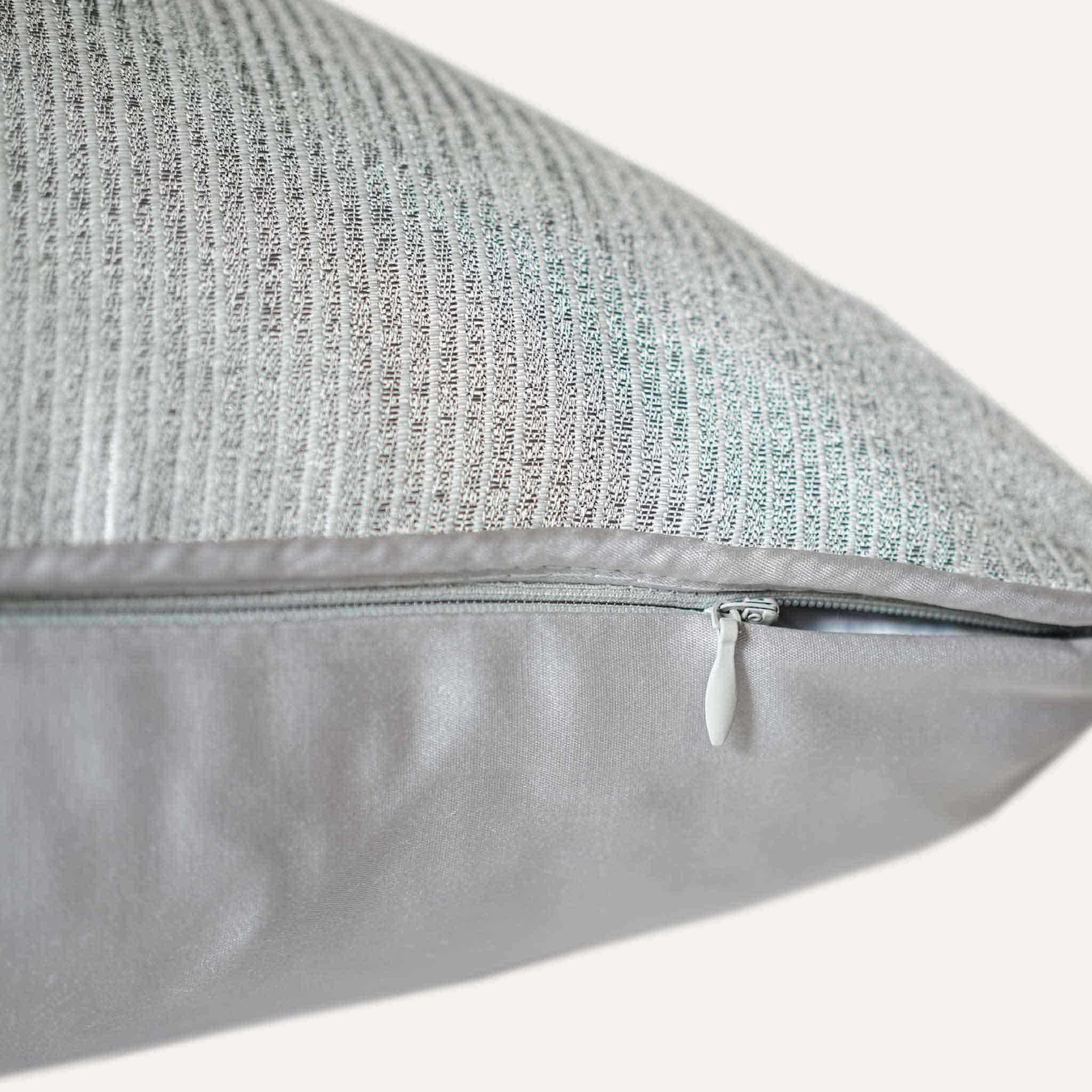 Luxurious silver gray cushion cover with chic striped design with invisible zipper.