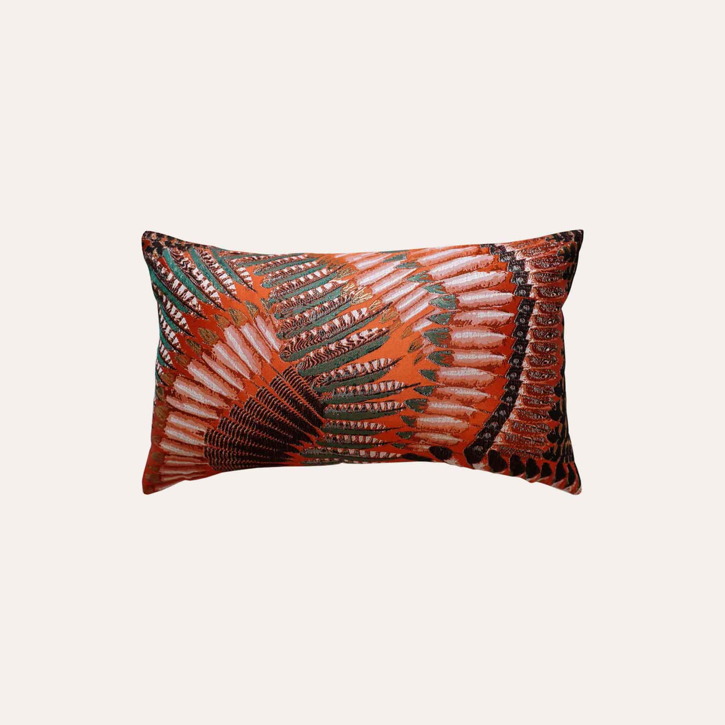 A pattern resembling orange, green, and white feathers on the lumbar cushion cover.