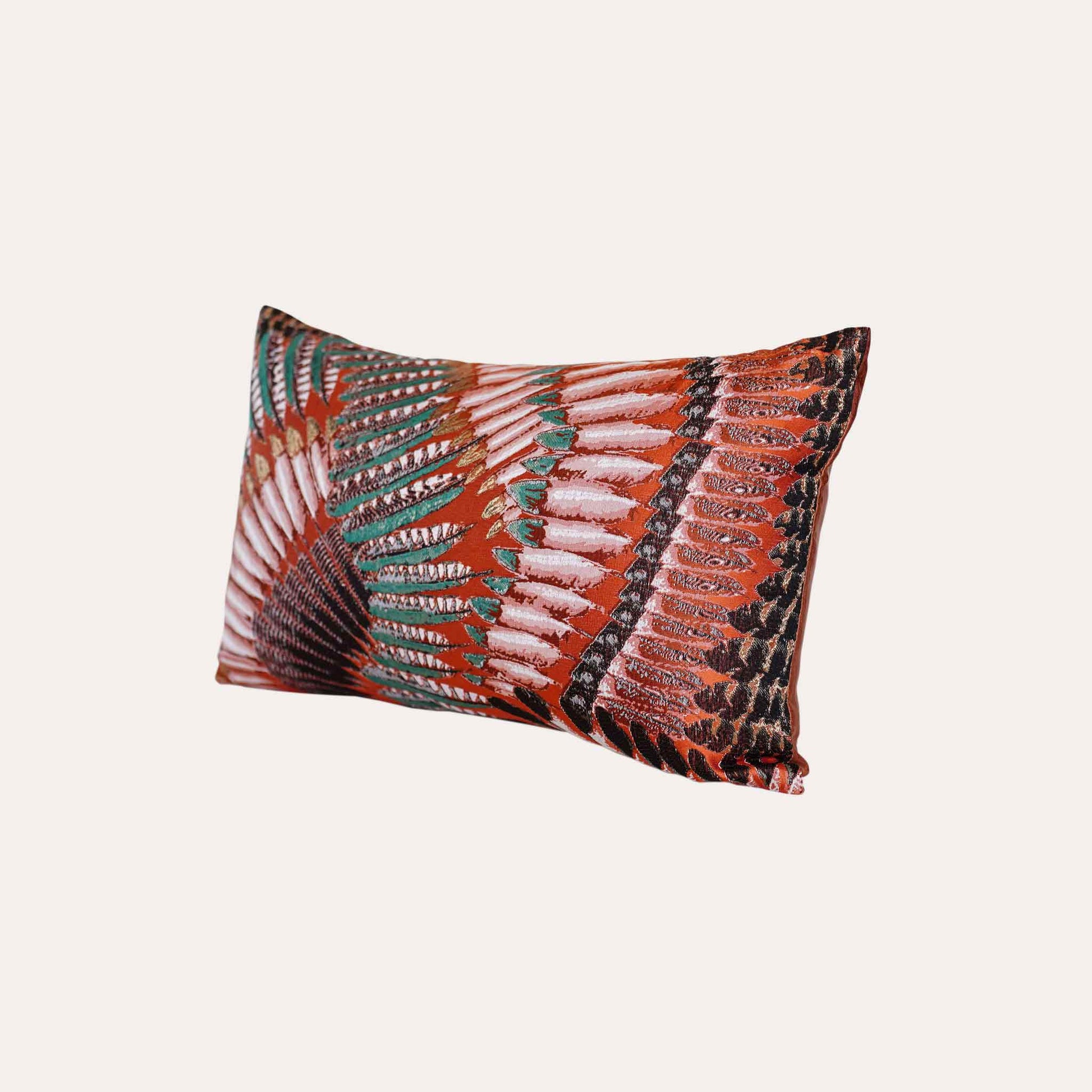 A pattern resembling orange, green, and white feathers on the lumbar cushion cover.