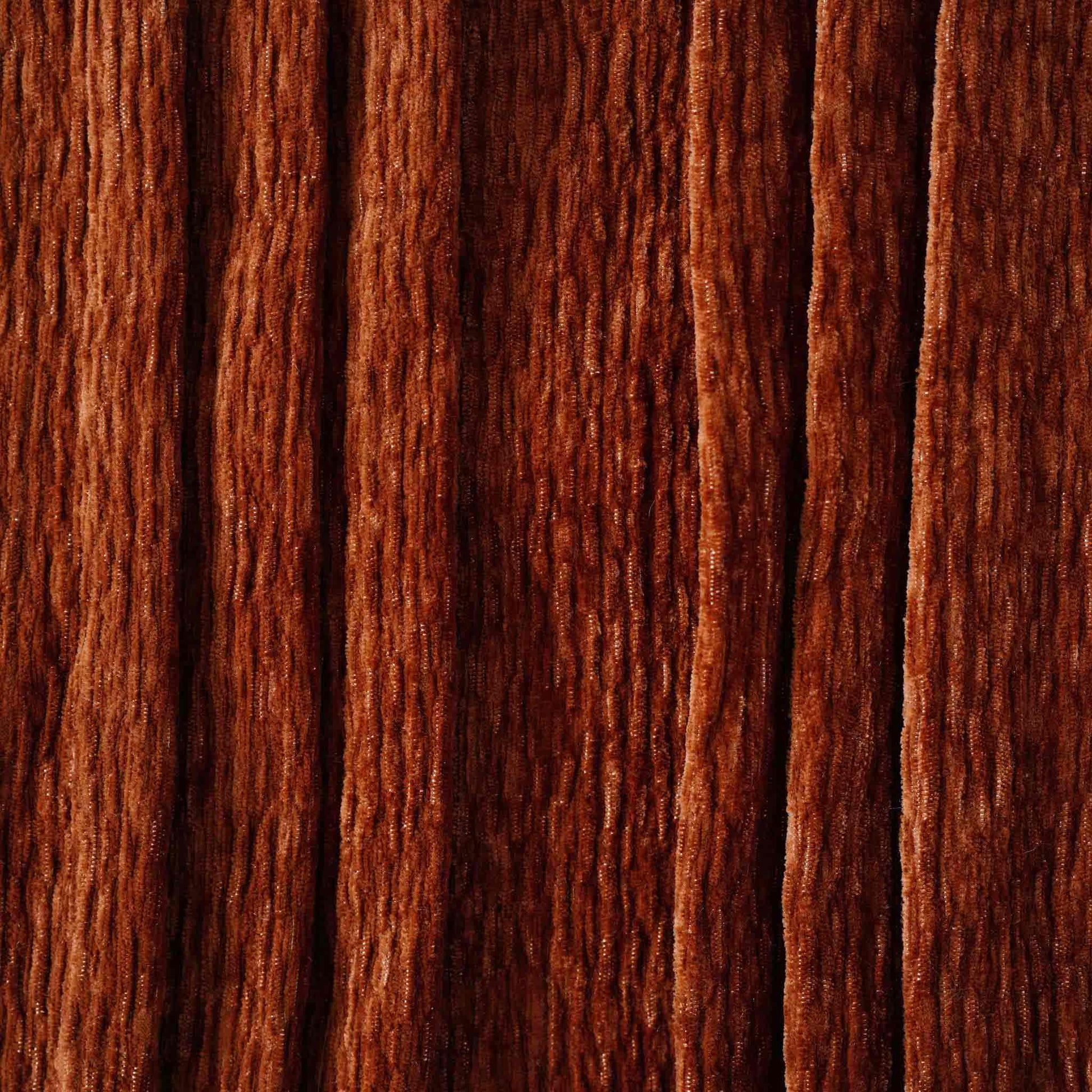 Soft, rust-toned cotton blend fabric features a three-dimensional pleated design.