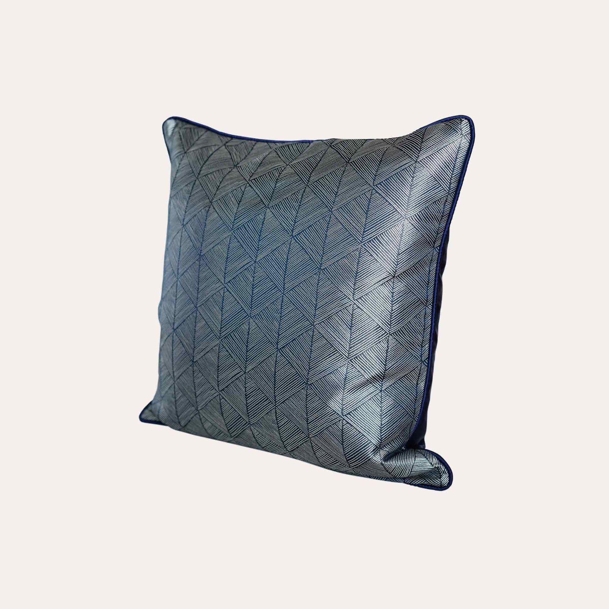 Luxurious silver blue accent cushion cover in a striking geometric triangle pattern.