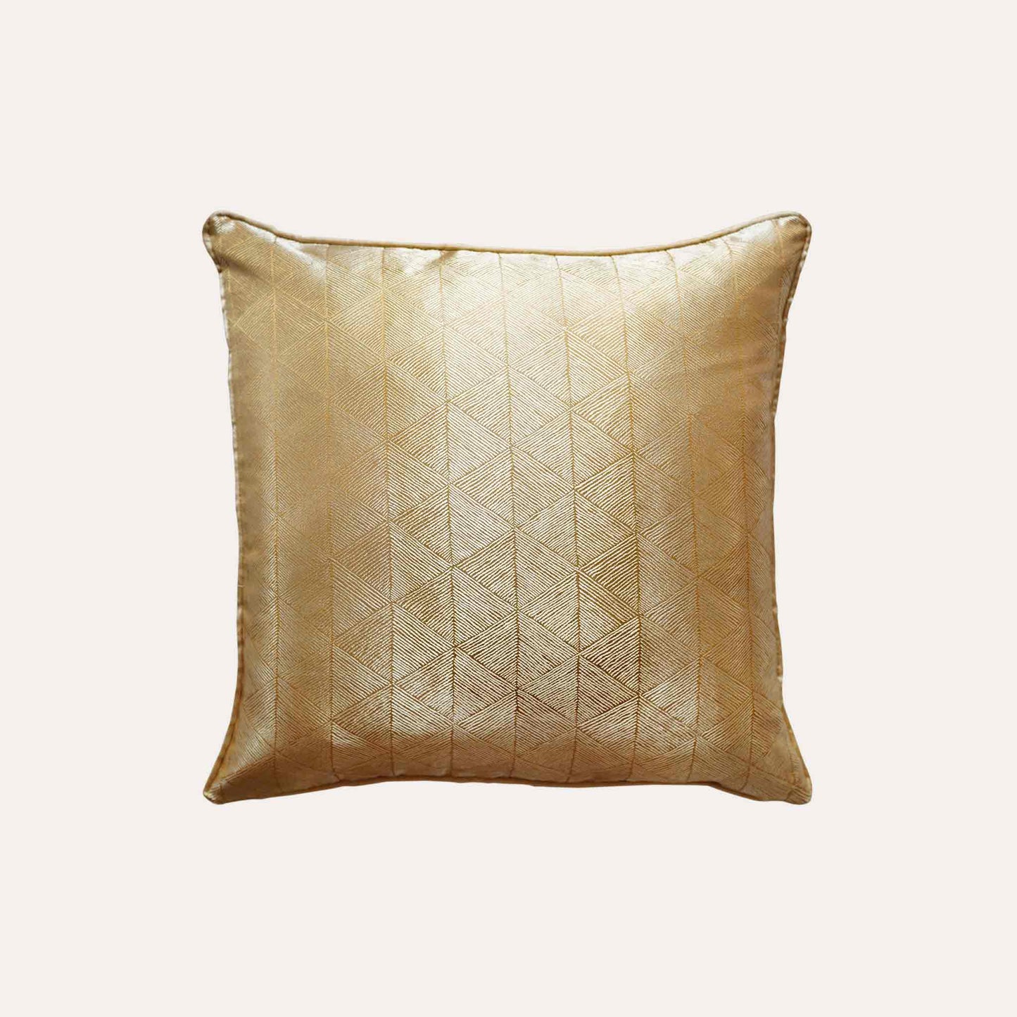 Luxurious gold accent cushion cover in a striking geometric triangle pattern.