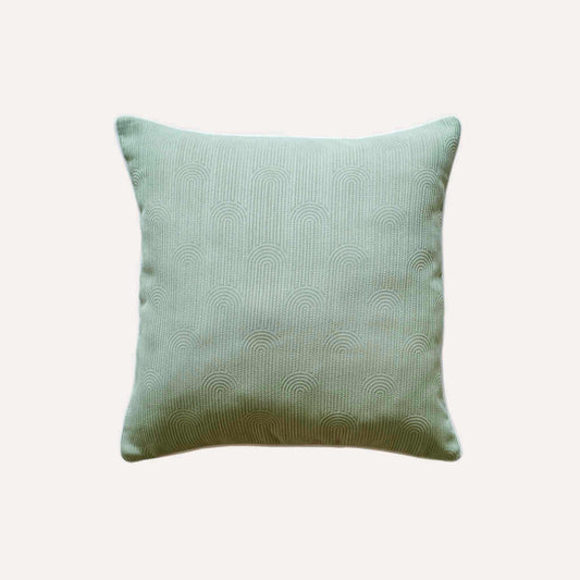 Mint green cushion cover with semi-curved texture and white wrapped edge.