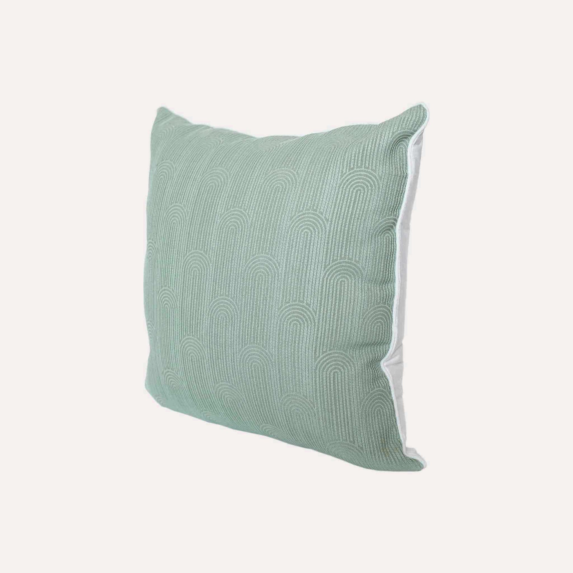 Mint green cushion cover with semi-curved texture and white wrapped edge.