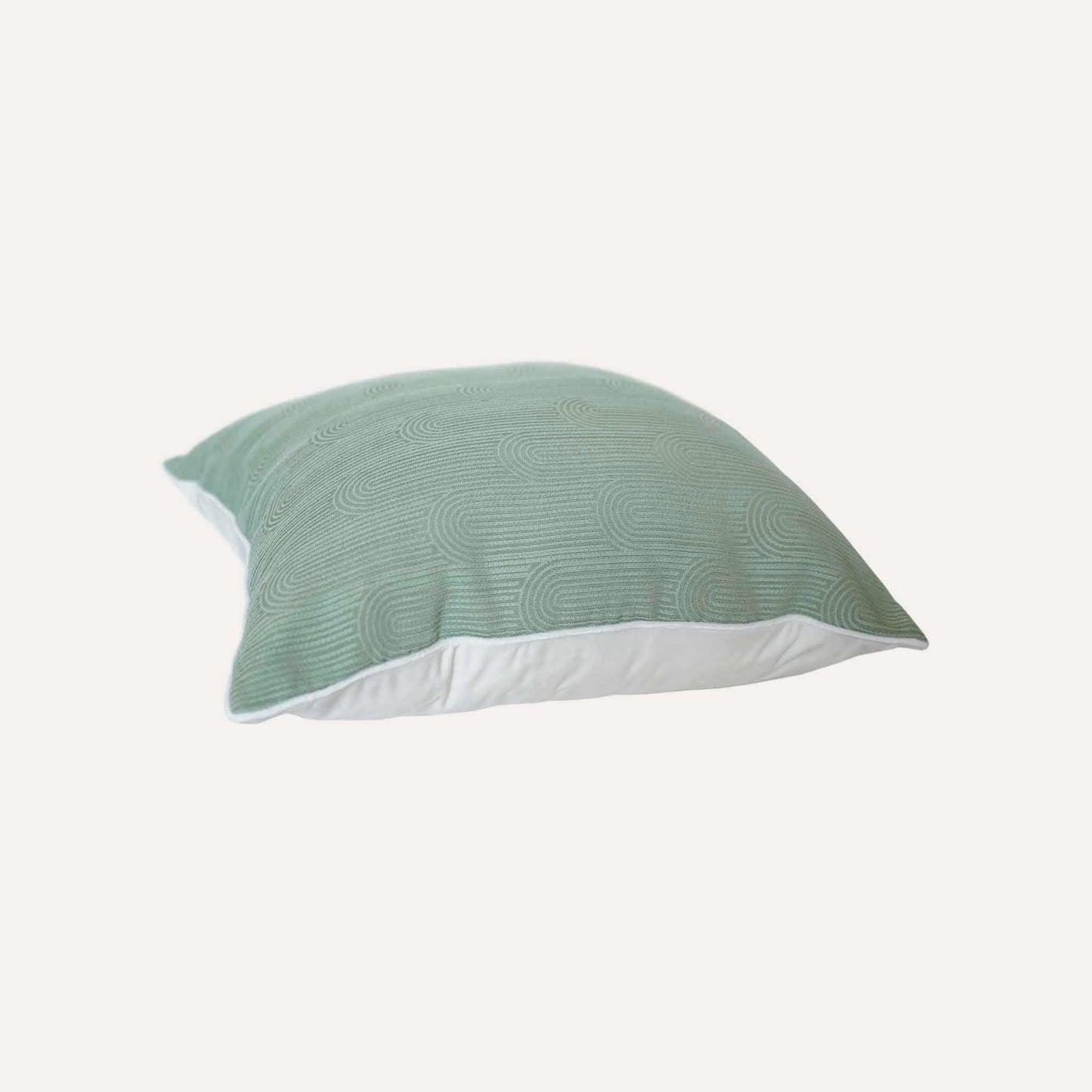 Mint green cushion cover with semi-curved texture and white wrapped edge.