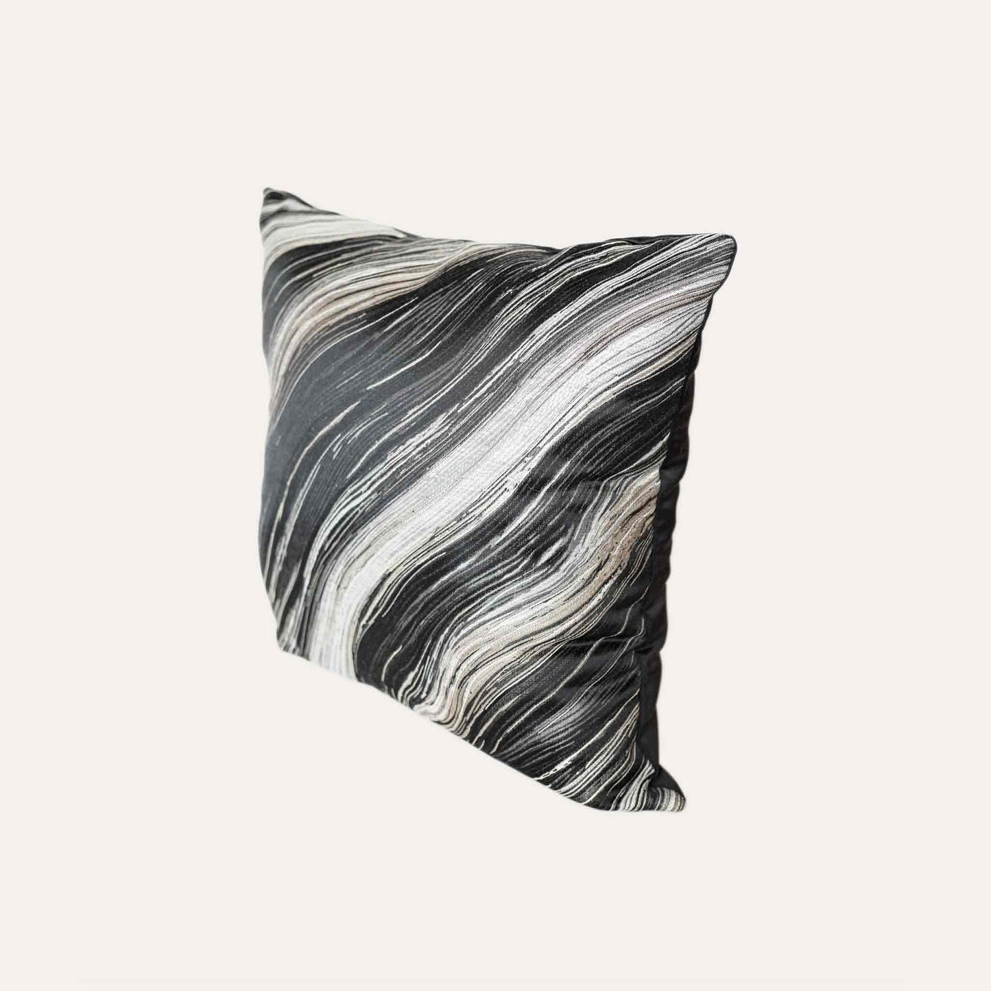 Black and gold abstract wave pattern cushion cover.