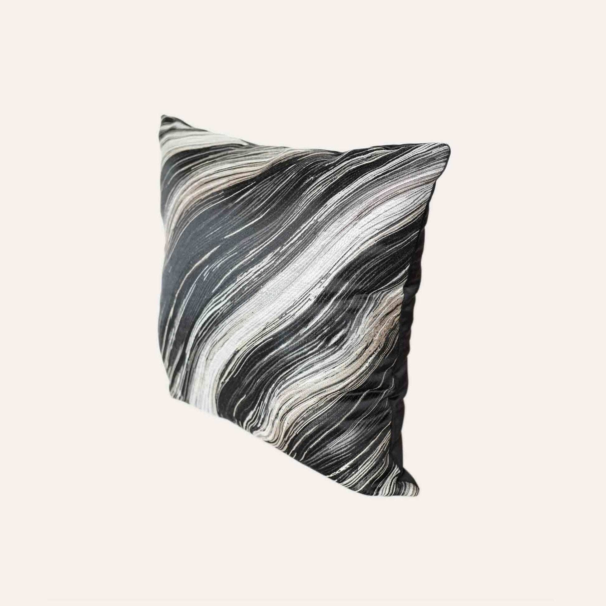 Black and gold abstract wave pattern cushion cover.