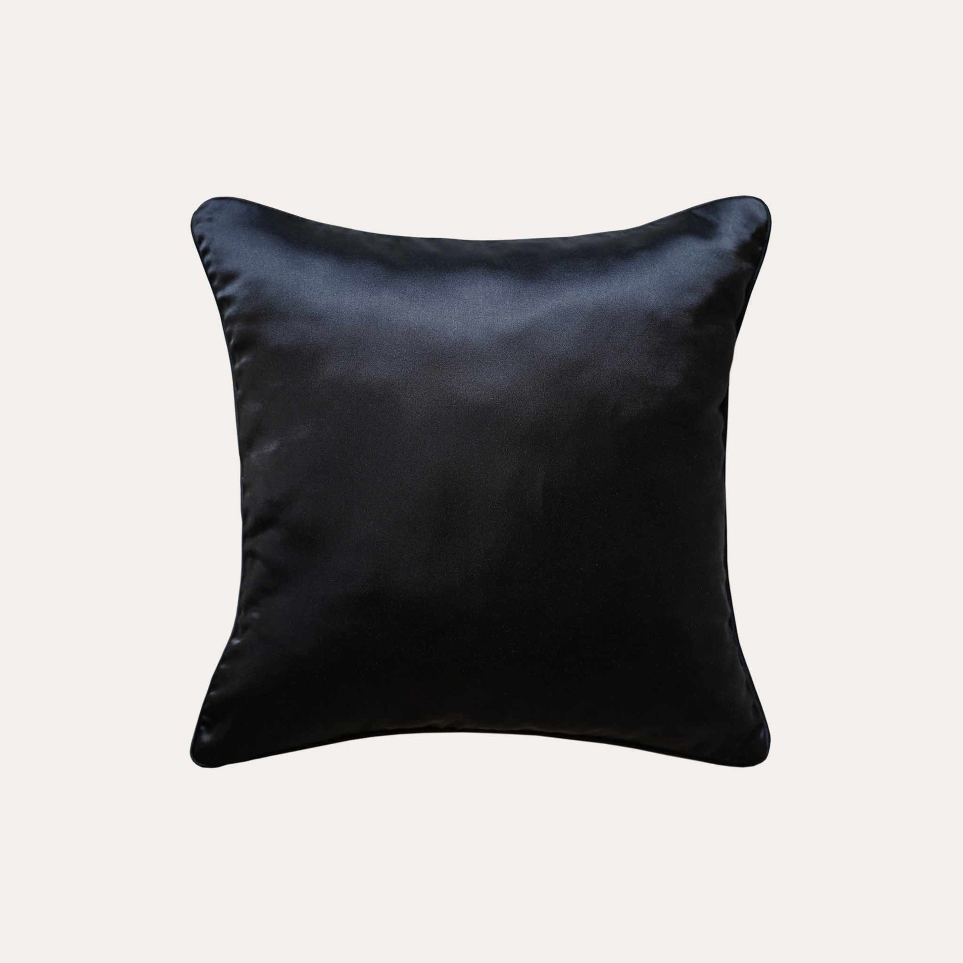 Contemporary black and orange 3D geometric cushion covers with black back.