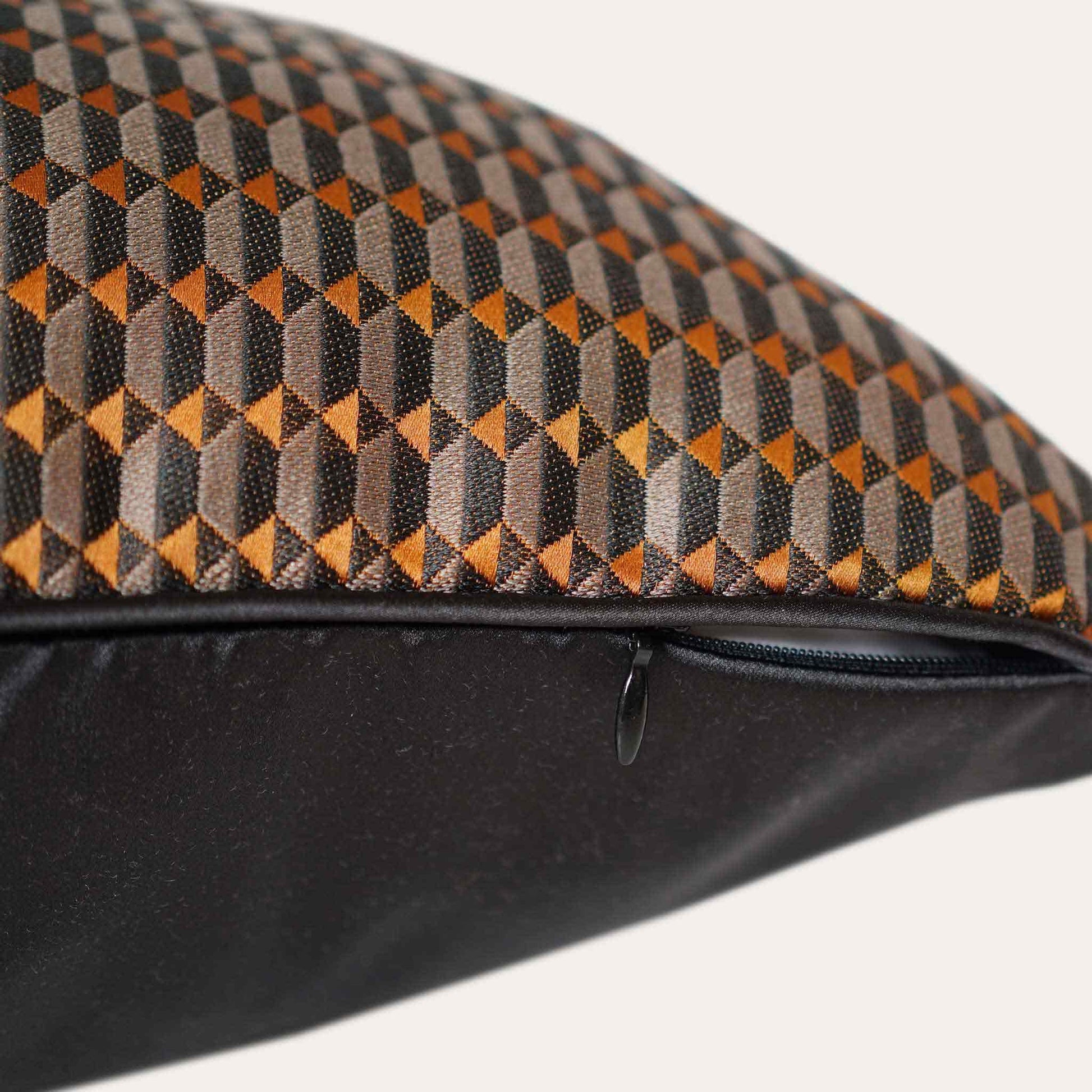 Contemporary black and orange 3D geometric cushion covers with invisible zipper.