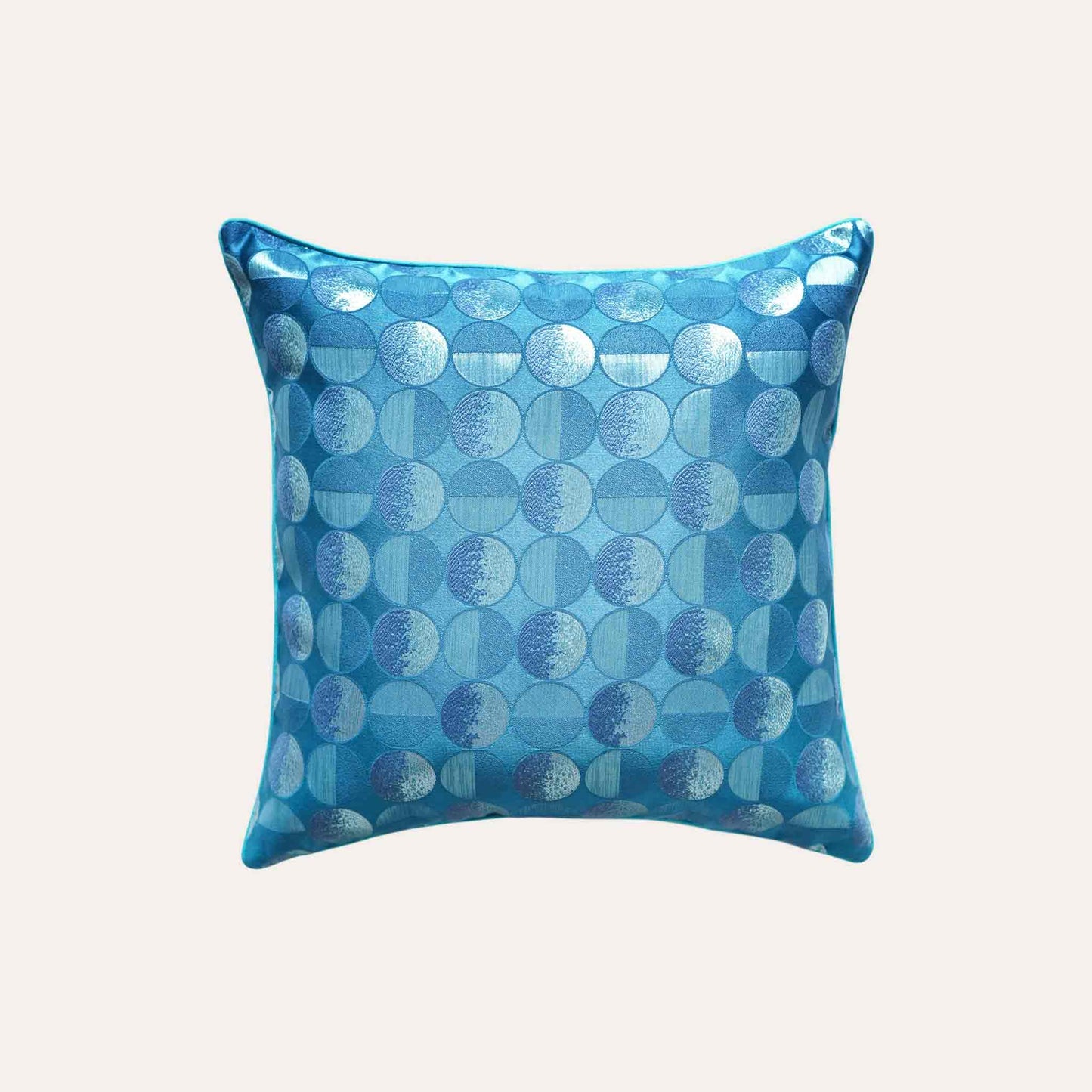 A blue sliver decorative cushion featuring a modern geometric circles pattern.