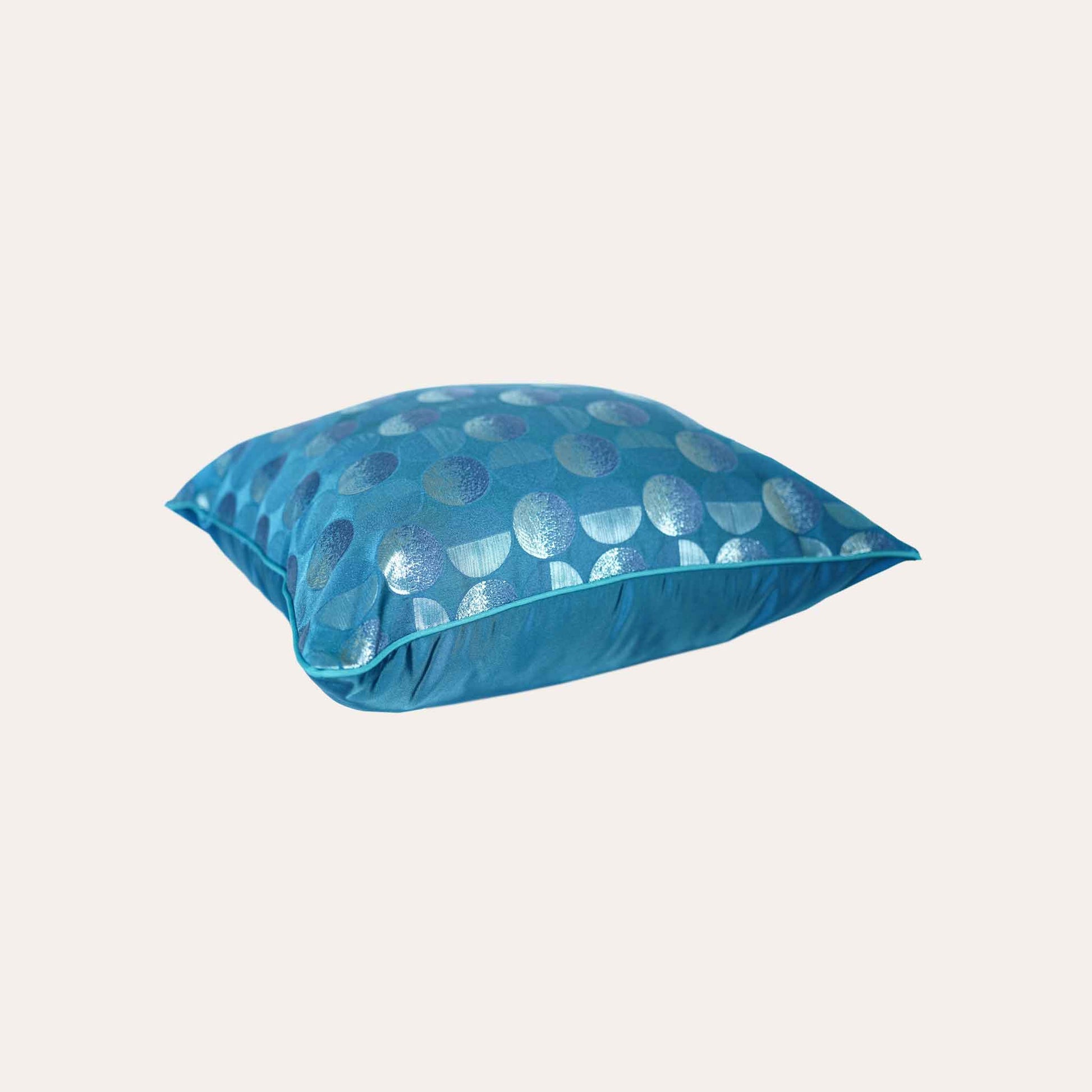A blue sliver decorative cushion featuring a modern geometric circles pattern.