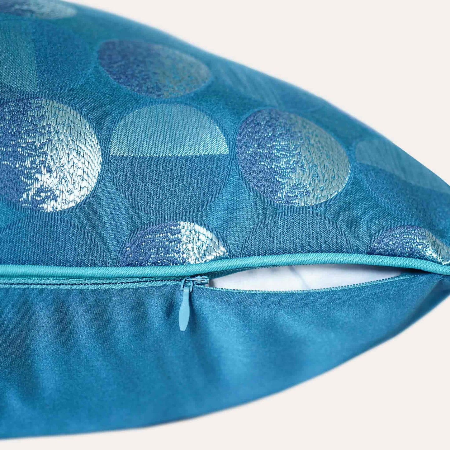 A blue sliver decorative cushion featuring a modern geometric circles pattern with invisible zipper.