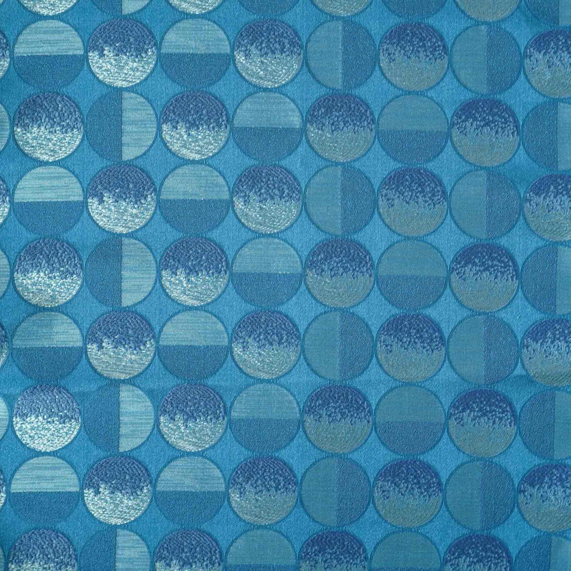 A blue sliver decorative cushion featuring a modern geometric circles pattern.