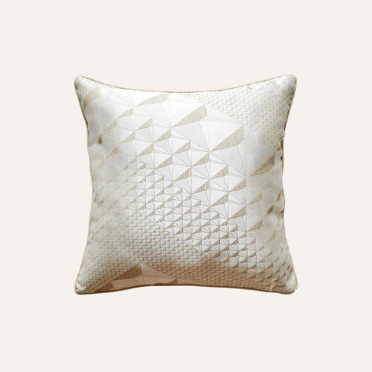 Exquisite geometric jacquard cushion covers in gold and champagne.