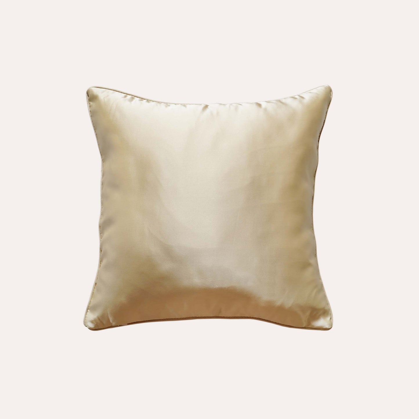 Exquisite geometric jacquard cushion covers in gold and champagne with solid gold back.