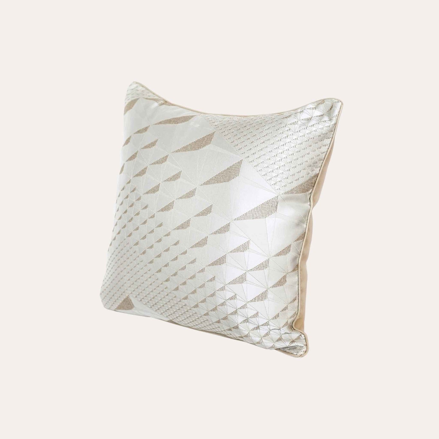 Exquisite geometric jacquard cushion covers in gold and champagne.