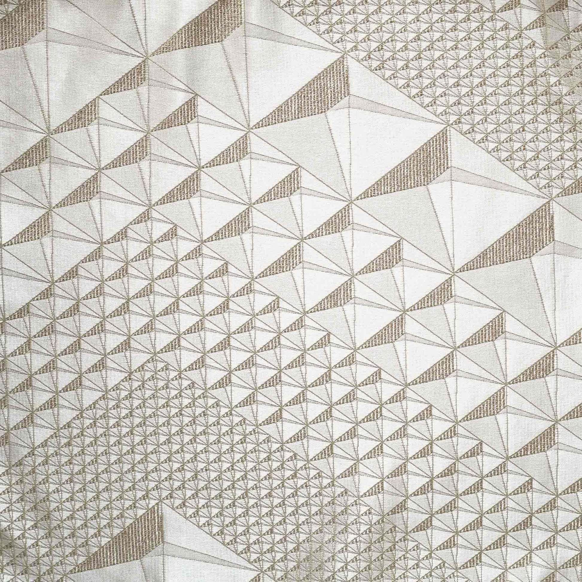 Exquisite geometric jacquard cushion covers in gold and champagne.